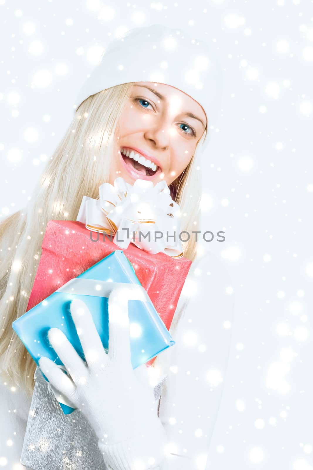 Happy woman holding Christmas gifts, silver background and snow  by Anneleven