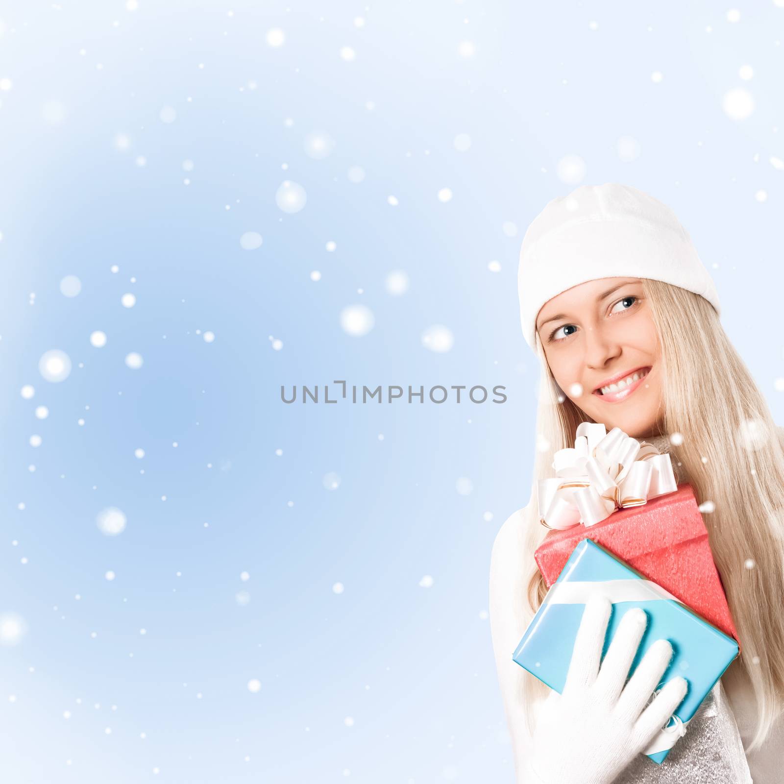Happy woman holding Christmas gifts, blue background and snow gl by Anneleven