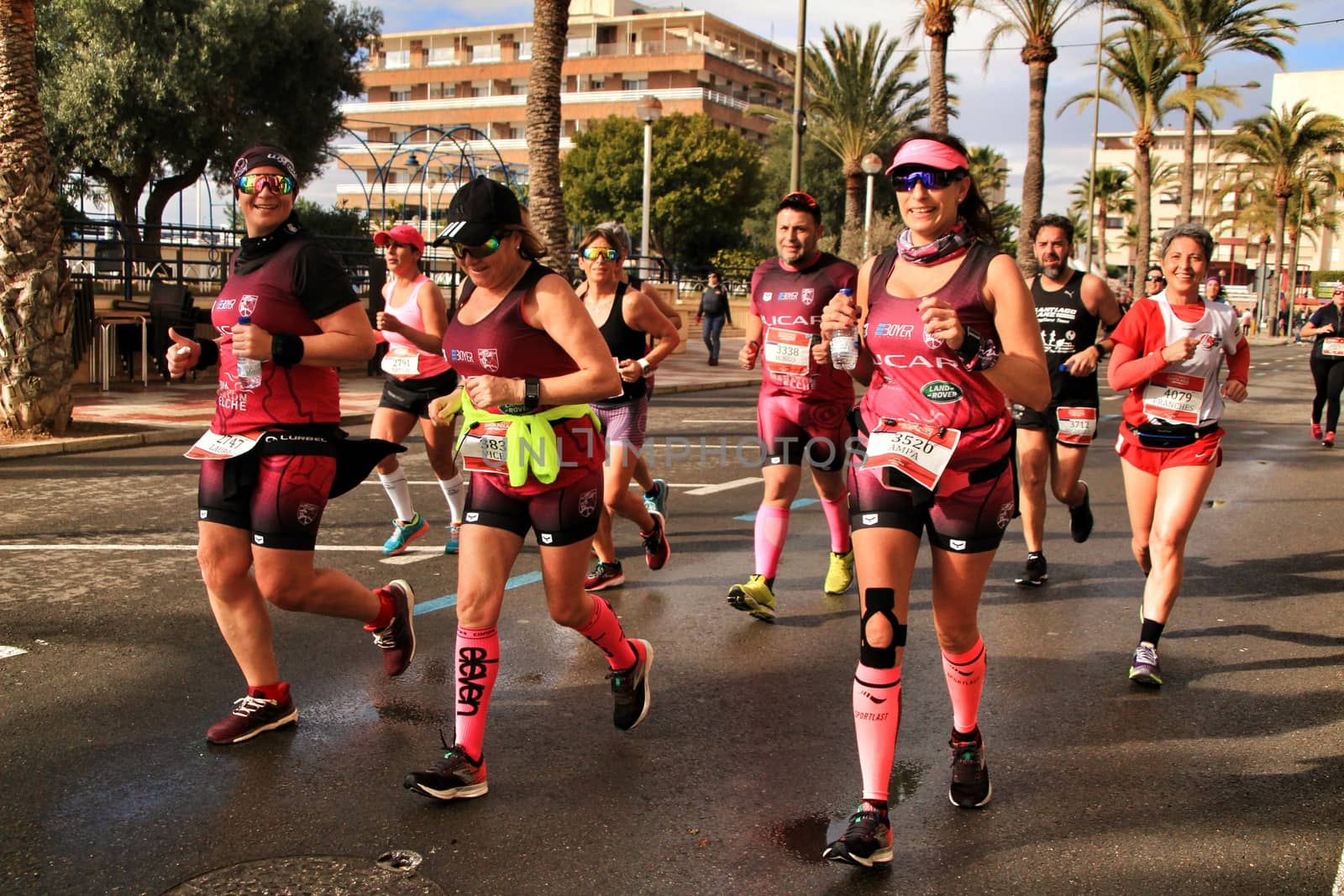 Santa Pola, Spain- January 20, 2019: Runners in the Half Marathon of the fishing village of Santa Pola, province of Alicante, on a sunny day in January