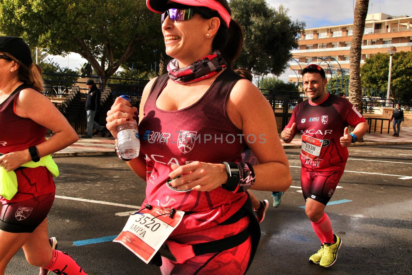 Santa Pola, Spain- January 20, 2019: Runners in the Half Marathon of the fishing village of Santa Pola, province of Alicante, on a sunny day in January
