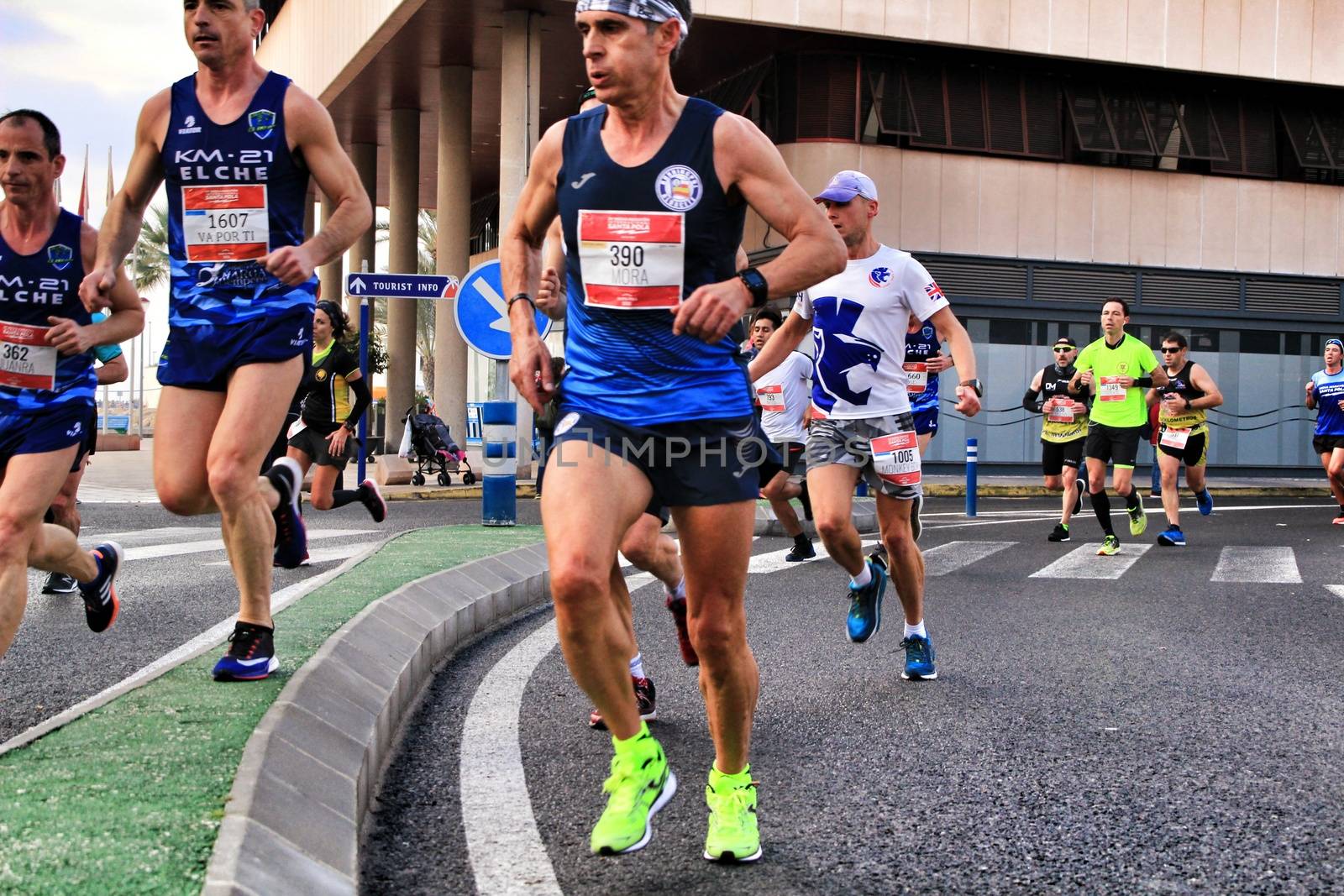 Santa Pola, Spain- January 20, 2019: Runners in the Half Marathon of the fishing village of Santa Pola, province of Alicante, on a sunny day in January