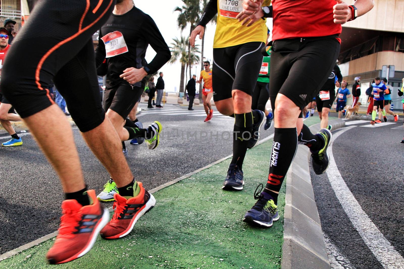 Santa Pola, Spain- January 20, 2019: Runners in the Half Marathon of the fishing village of Santa Pola, province of Alicante, on a sunny day in January