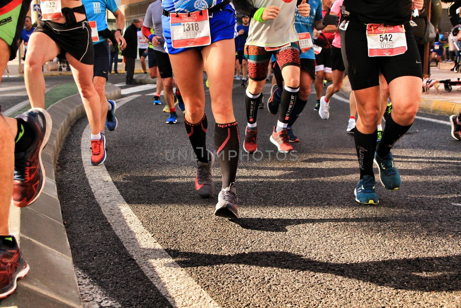Santa Pola, Spain- January 20, 2019: Runners in the Half Marathon of the fishing village of Santa Pola, province of Alicante, on a sunny day in January