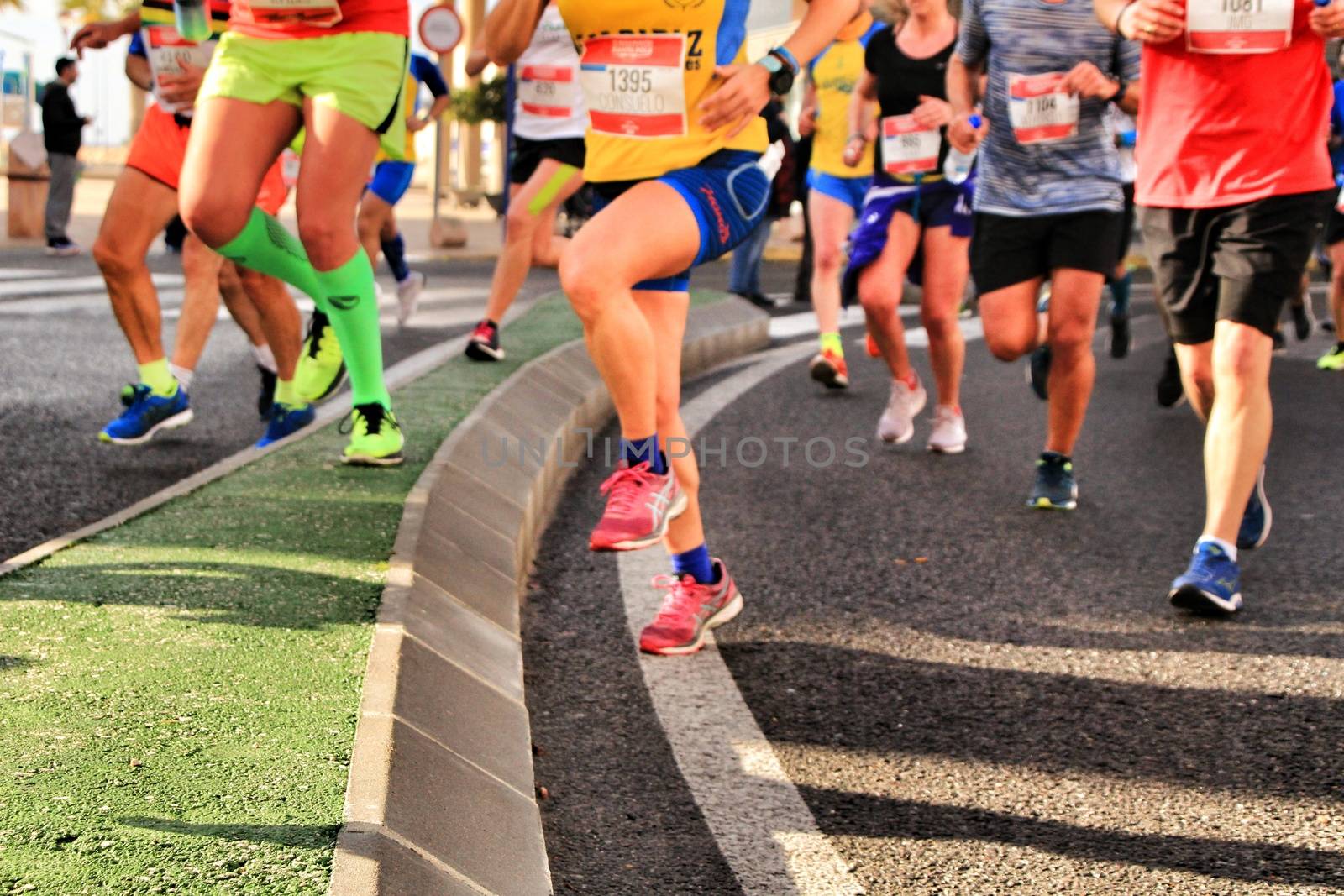 Santa Pola, Spain- January 20, 2019: Runners in the Half Marathon of the fishing village of Santa Pola, province of Alicante, on a sunny day in January