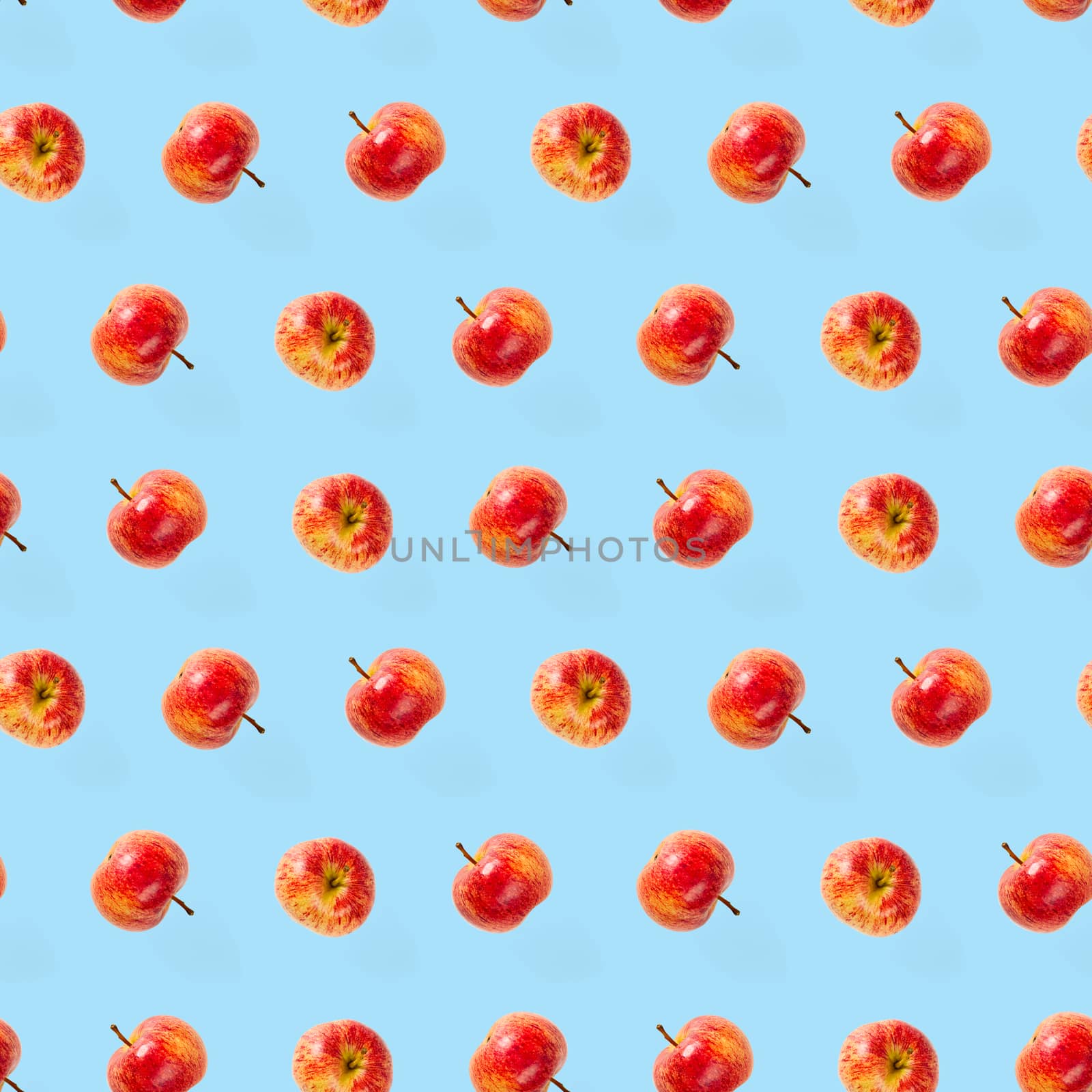 Seamless pattern with ripe apples. Apple seamless pattern on blue background. Tropical fruit abstract background.