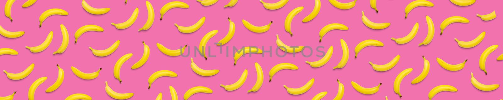 Bananas creative background. pop art bananas background. Tropical abstract background with banana. Colorful fruit yellow banana by PhotoTime