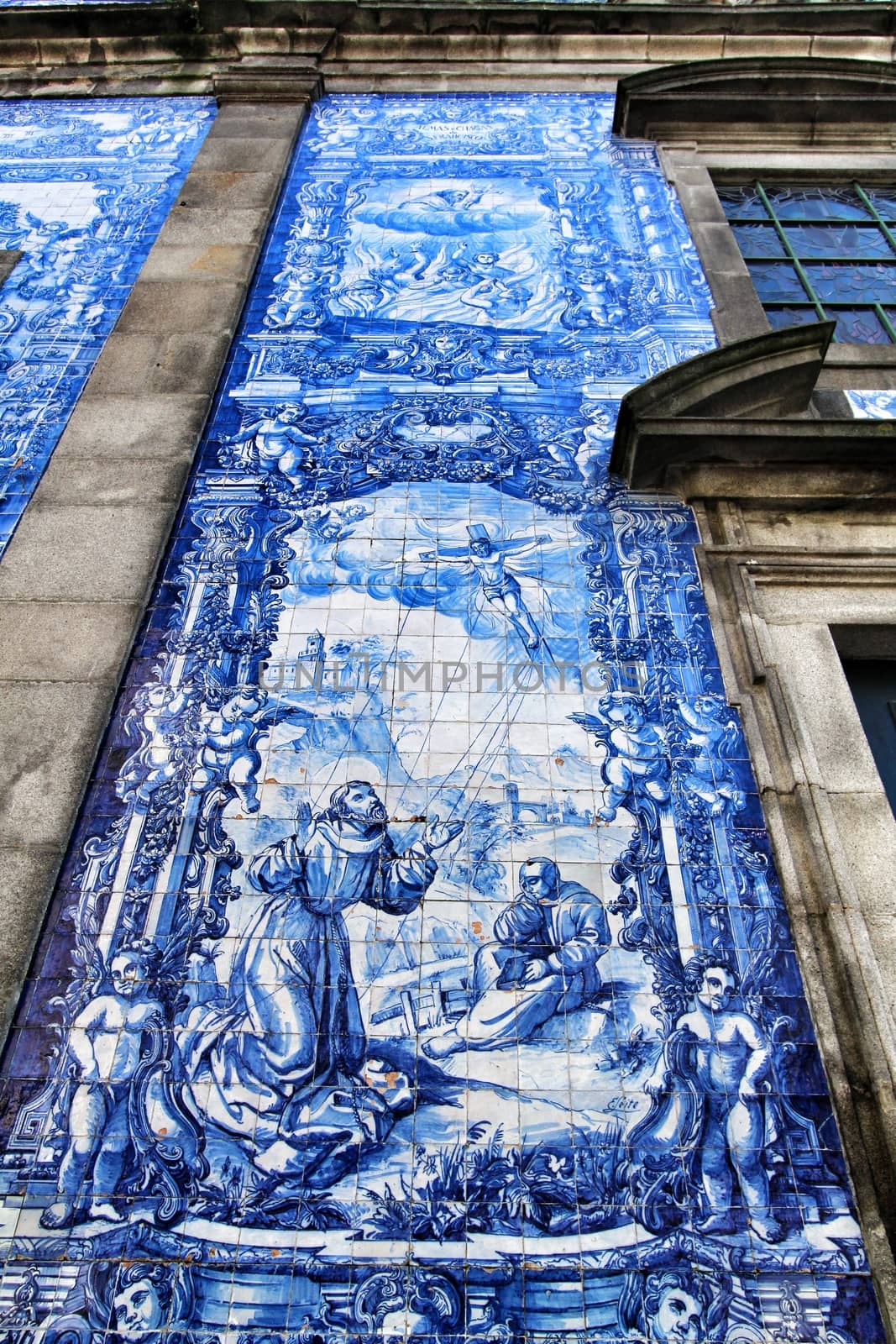 Oporto, Portugal- January 2, 2020: Beautiful and old tiled facade of Capela das Almas church in Oporto, Portugal