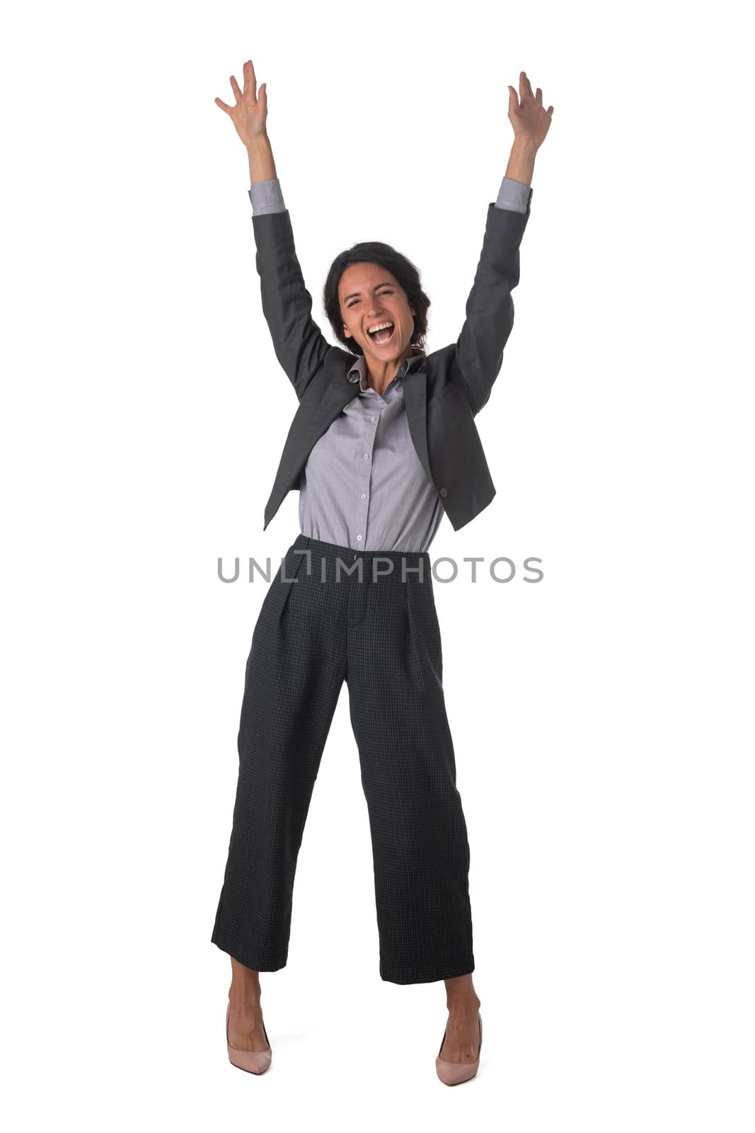 Young business woman winner with arms raised isolated on white background full length studio portrait