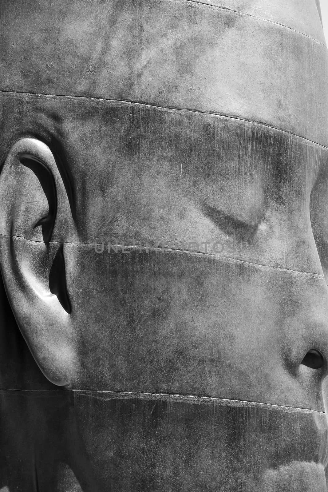 Elche, Alicante, Spain- July 20, 2020: Beautiful three-dimensional sculpture of a woman's face of the artist Jaume Plensa exhibited in the main square of Elche