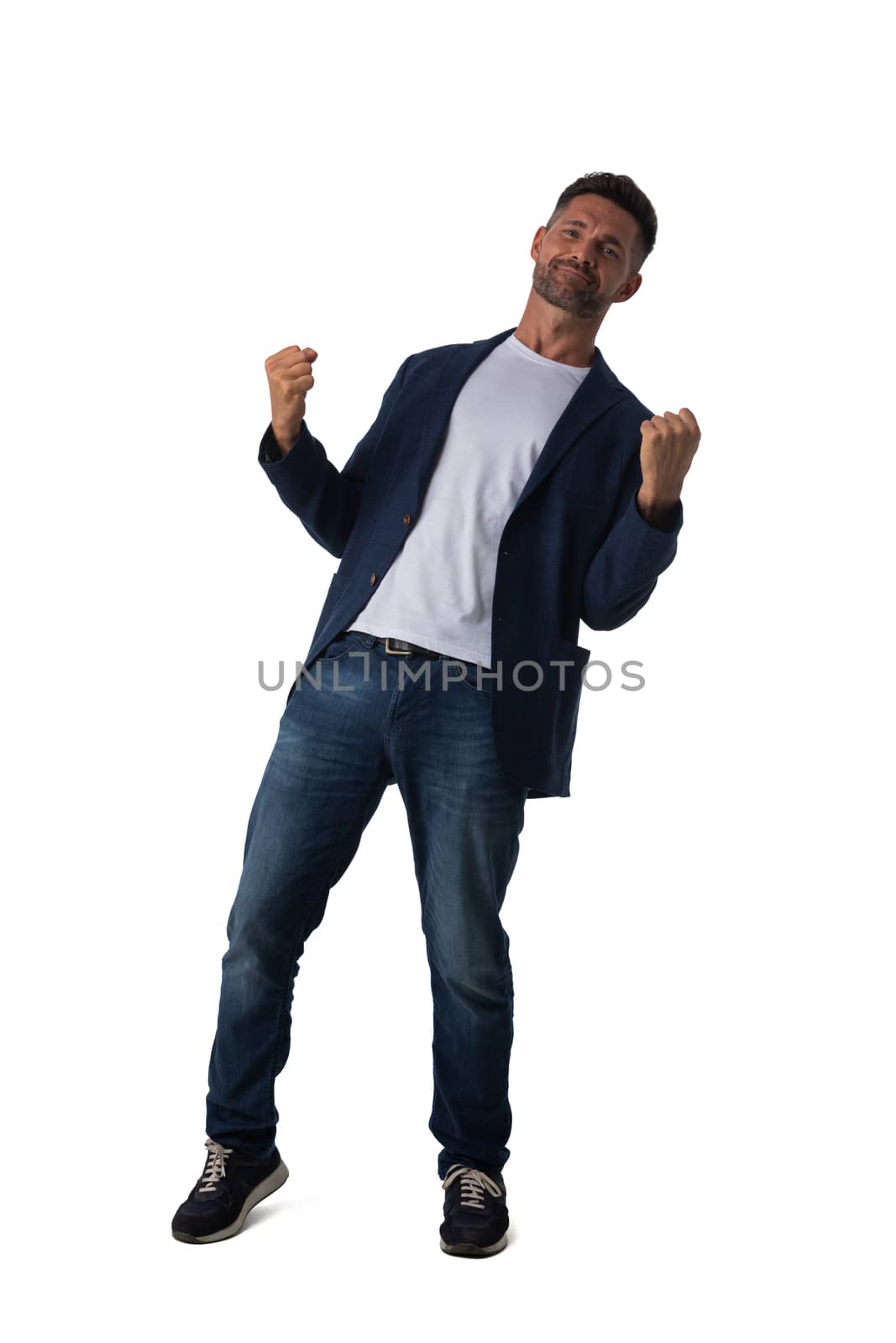 Young business man winner holding fists isolated on white background full length studio portrait