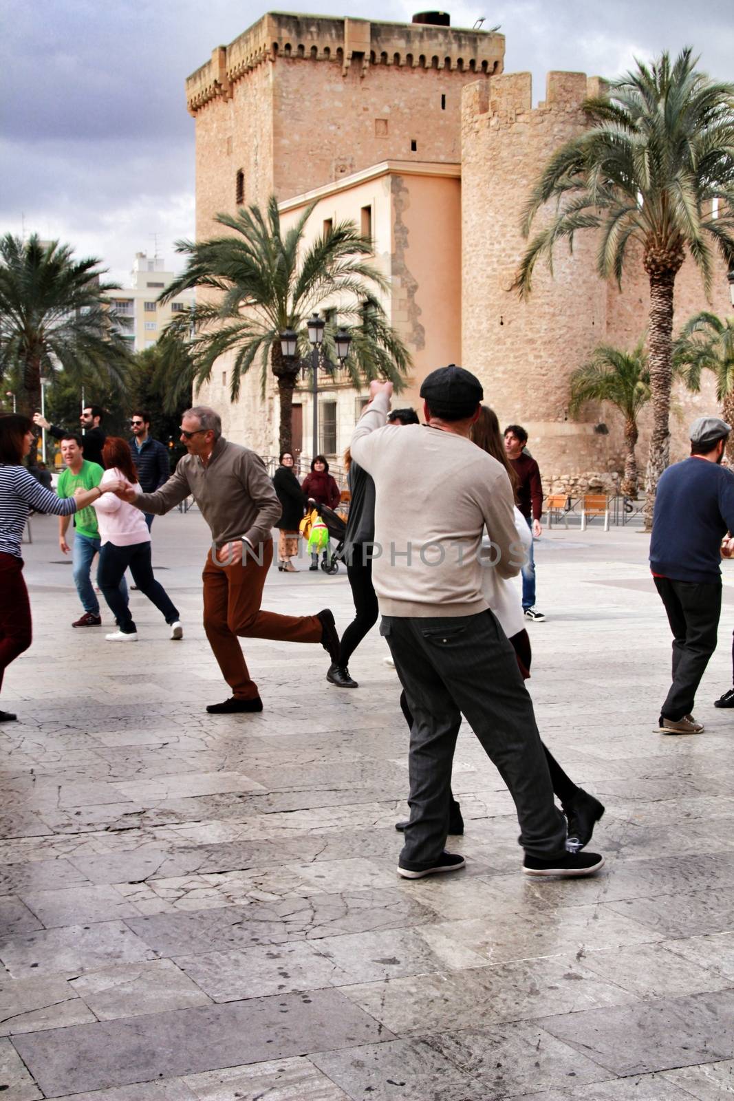 Elche, Alicante, Spain- February 19, 2019: People enjoying and dancing swing in the street in winter