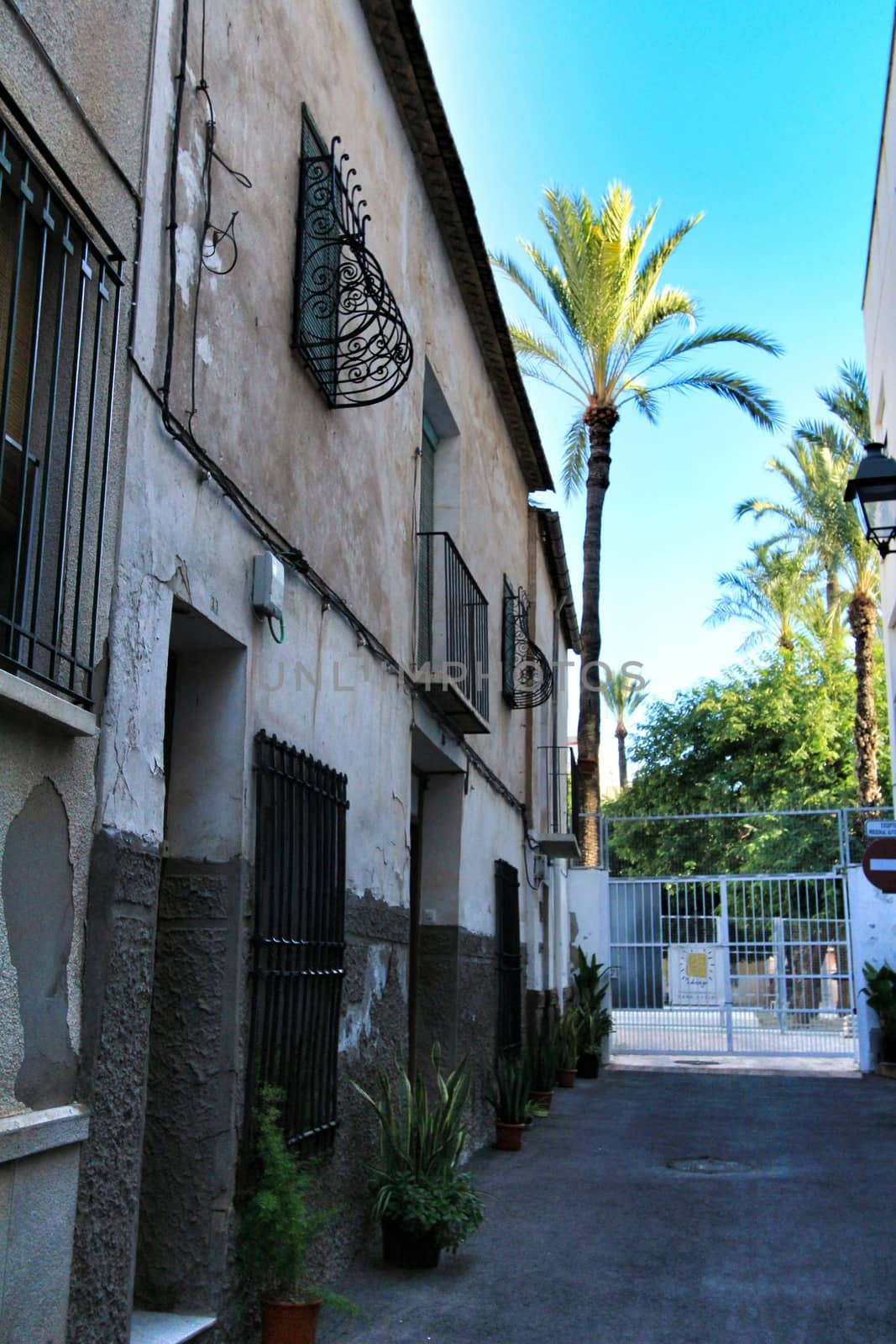 Elche, Alicante, Spain- September 9, 2020: Streets, majestic facades, windows and balconies of Elche city. Alicante province, Spain.