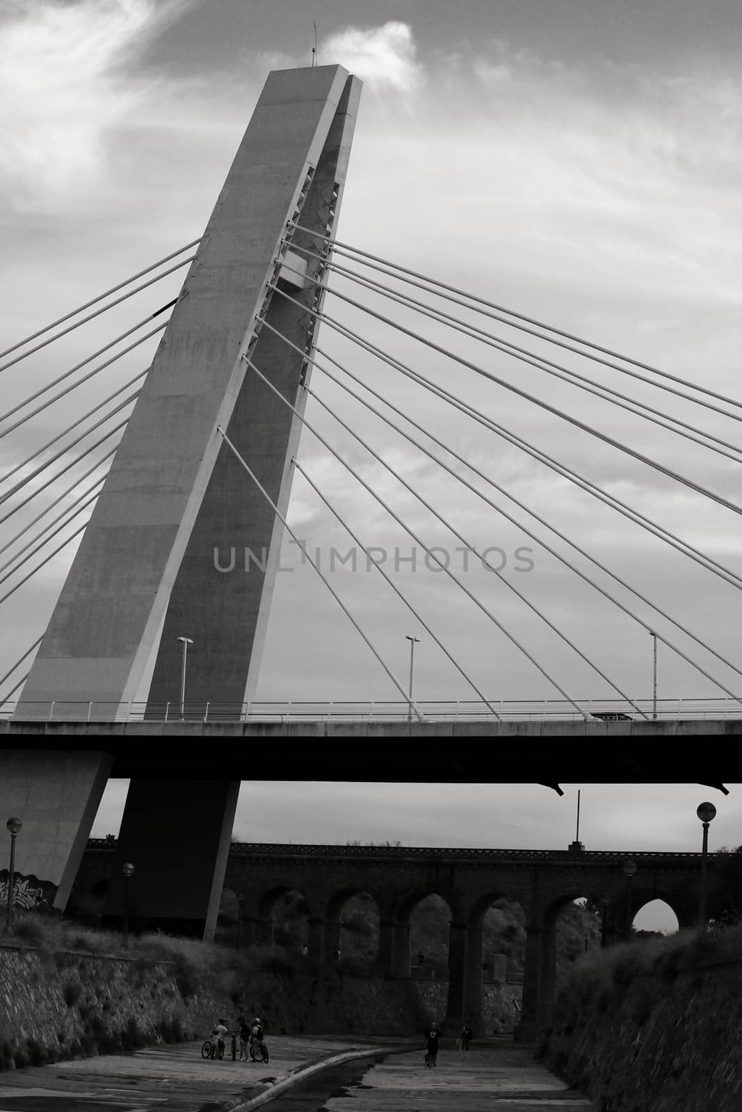 Elche, Alicante, Spain- September 13, 2020: Pont de la Generalitat under cloudy sky next to the Vinalopo River in Elche