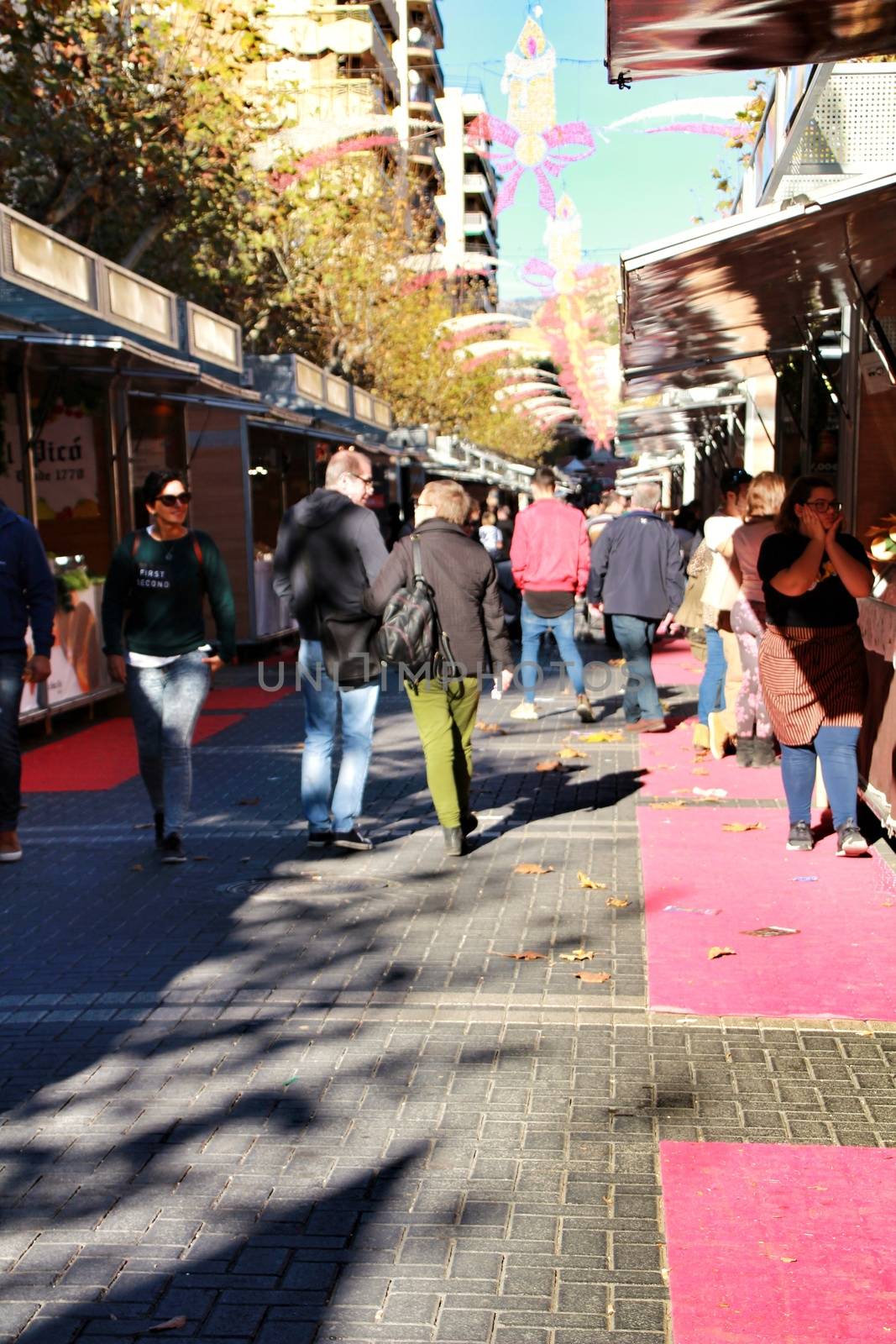 Jijona, Alicante, Spain- December 9, 2018: People walking and buying traditional nougat at the Jijona Christmas Fair