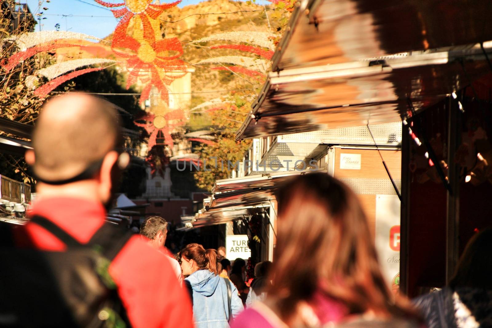 Jijona, Alicante, Spain- December 9, 2018: People walking and buying traditional nougat at the Jijona Christmas Fair