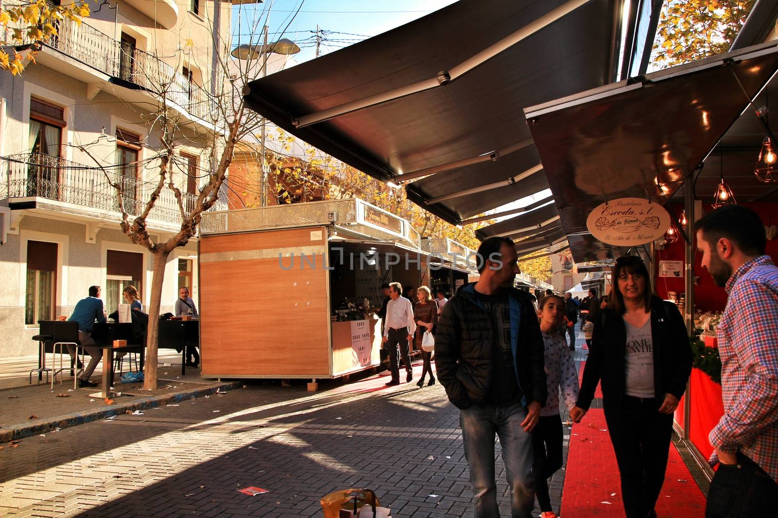 Jijona, Alicante, Spain- December 9, 2018: People walking and buying traditional nougat at the Jijona Christmas Fair
