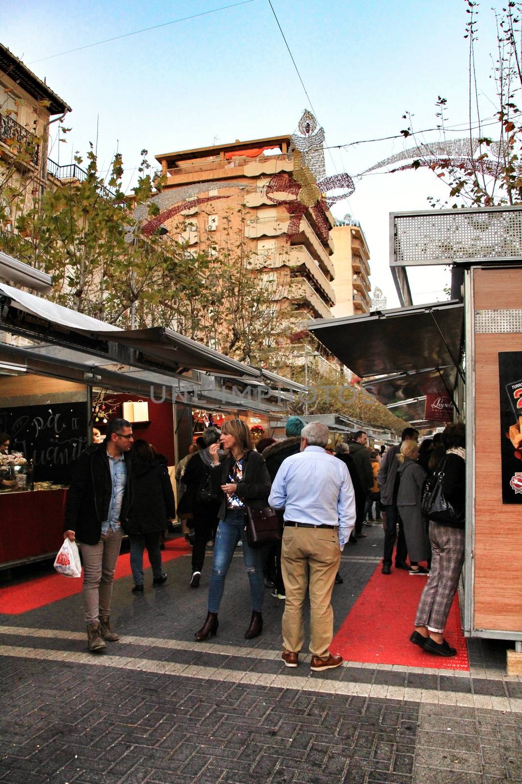 Jijona, Alicante, Spain- December 9, 2018: People walking and buying traditional nougat at the Jijona Christmas Fair