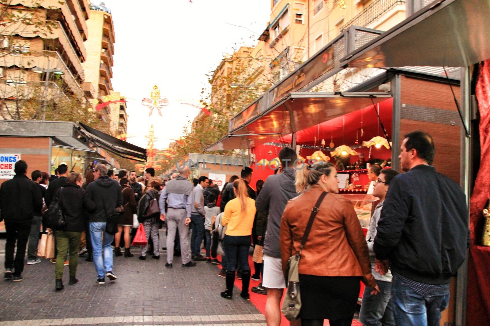 Jijona, Alicante, Spain- December 9, 2018: People walking and buying traditional nougat at the Jijona Christmas Fair