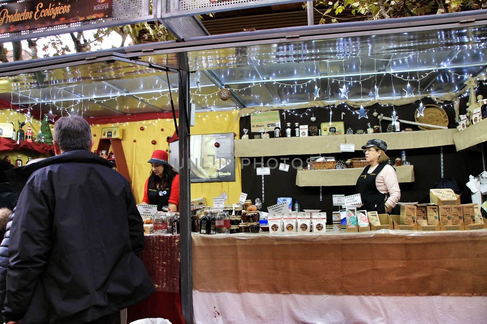Jijona, Alicante, Spain- December 9, 2018: People walking and buying traditional nougat at the Jijona Christmas Fair