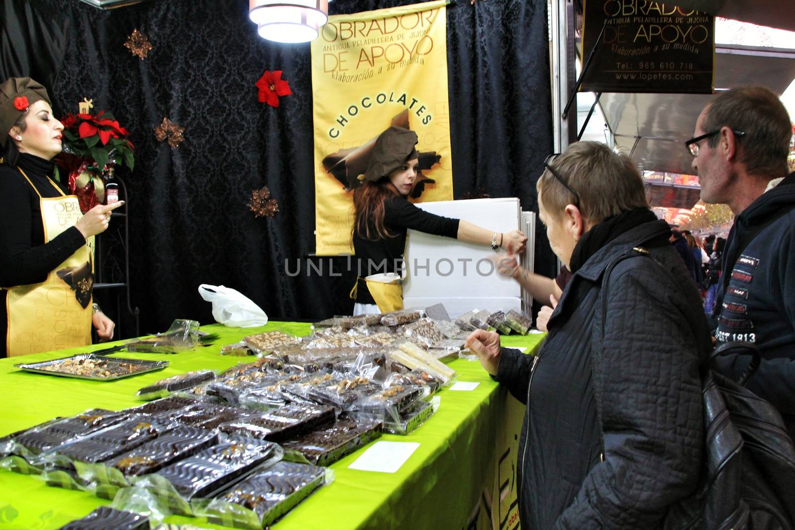 Jijona, Alicante, Spain- December 9, 2018: People walking and buying traditional nougat at the Jijona Christmas Fair