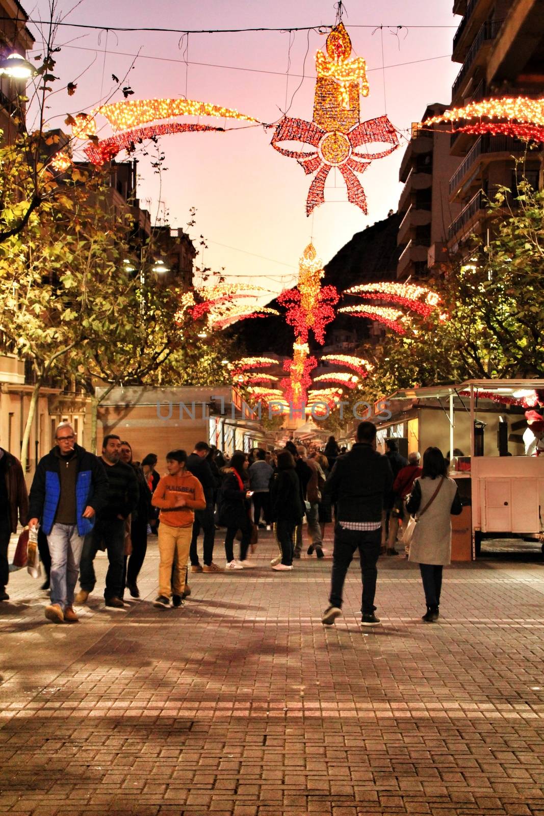 Jijona, Alicante, Spain- December 9, 2018: People walking and buying traditional nougat at the Jijona Christmas Fair