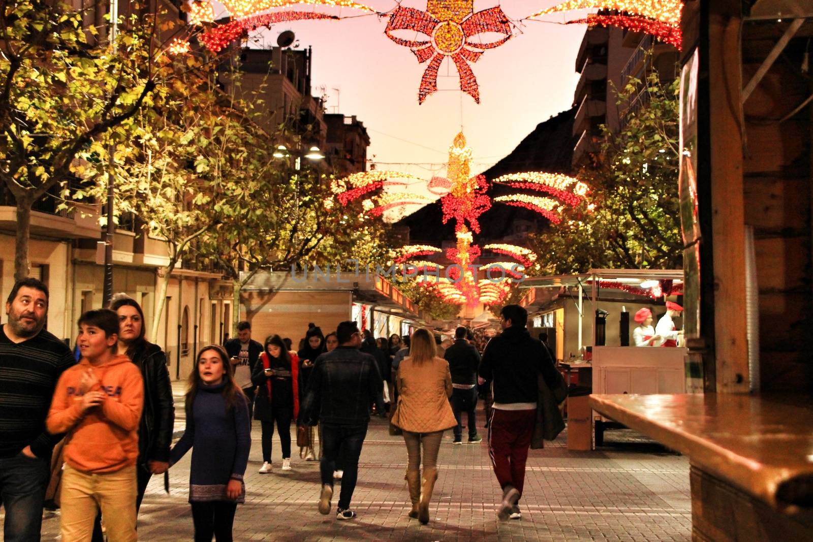 Jijona, Alicante, Spain- December 9, 2018: People walking and buying traditional nougat at the Jijona Christmas Fair