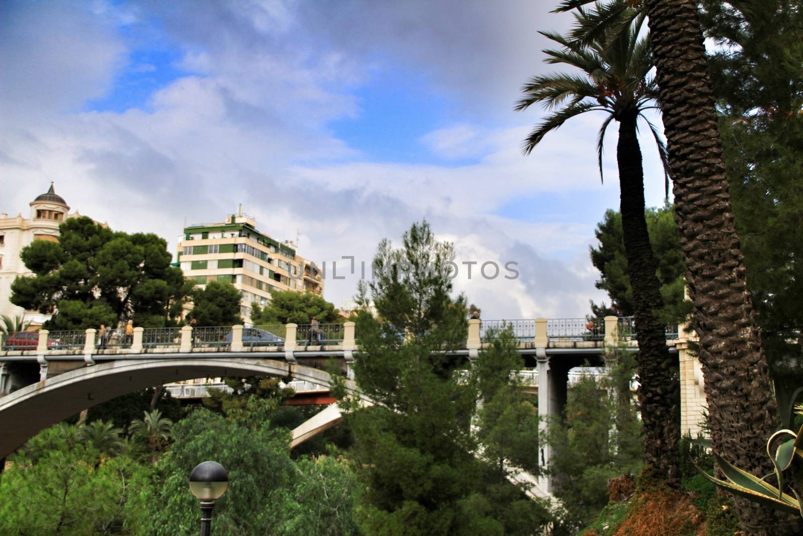 Elche, Alicante, Spain- November 16, 2018 - Landscape of the hillside of the Vinalopo River in Elche with its bridges and green vegetation after a rainy day of Autumn