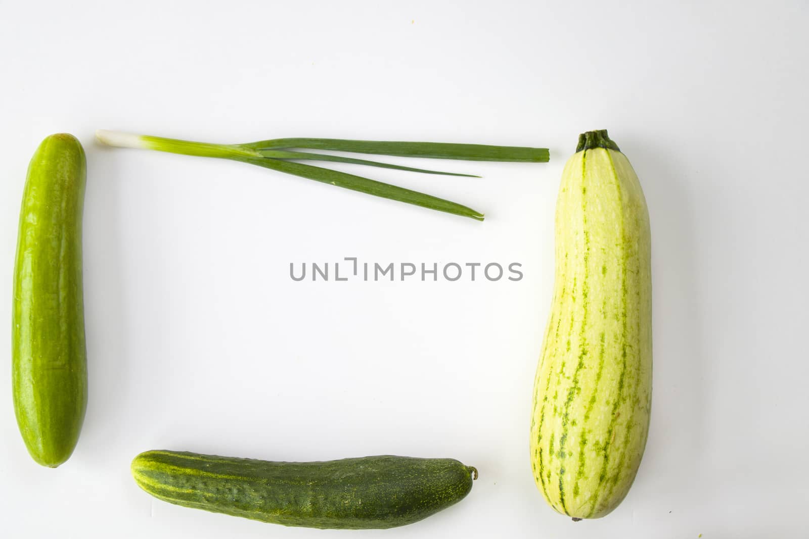 Green vegetables on the white background, high angle view