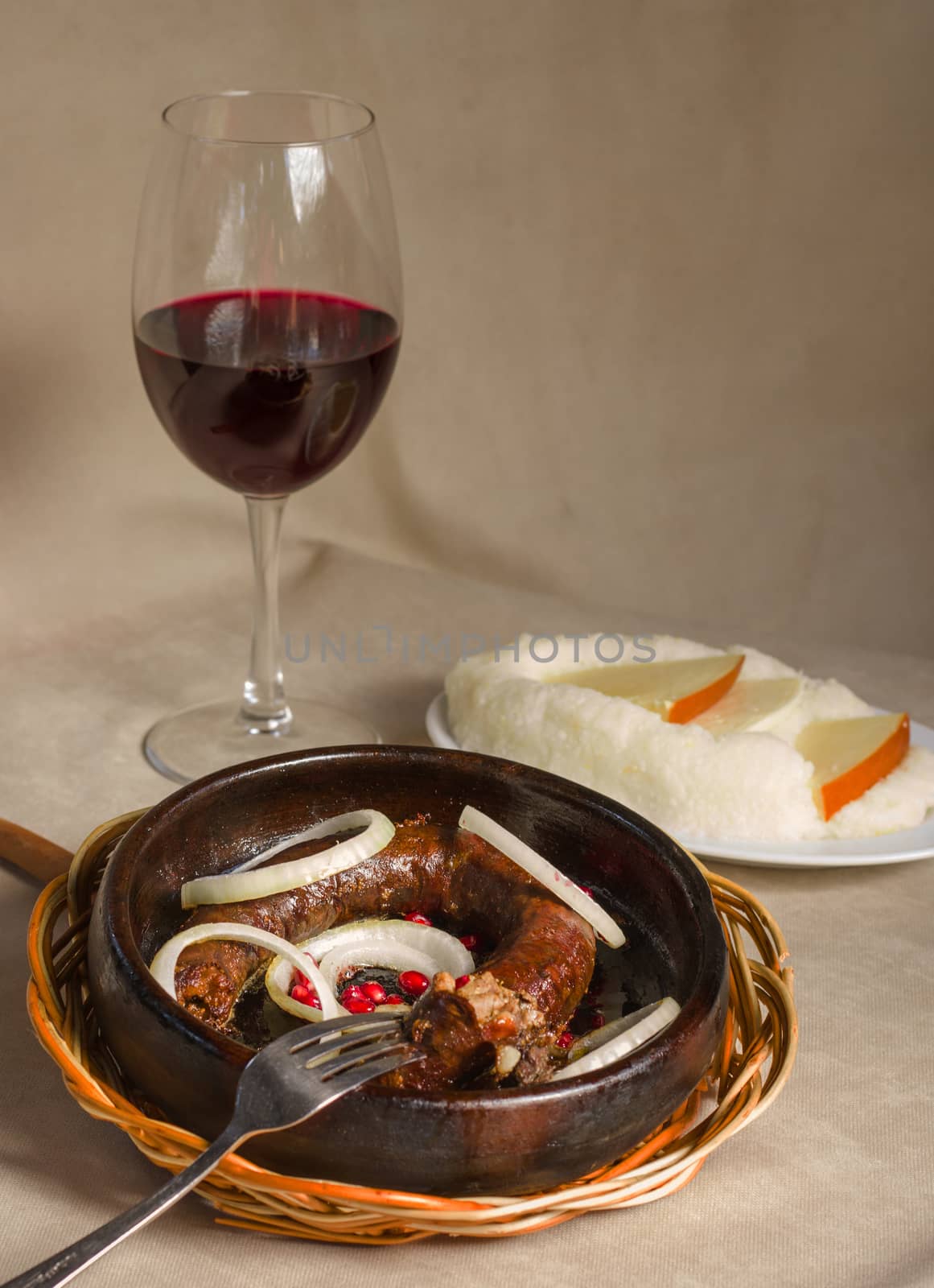 Georgian traditional food and cuisine Kupati and red wine, ghomi and cheese. by Taidundua