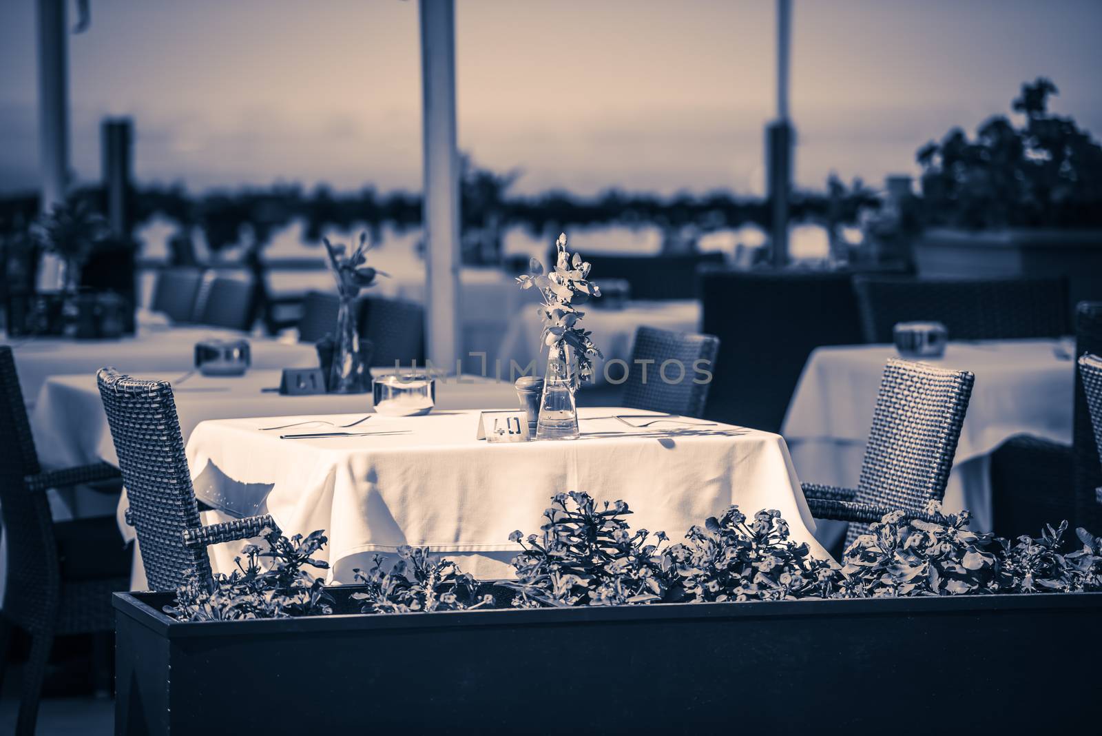 outside tables at restaurant in Tenerife, Spain by Nanisimova