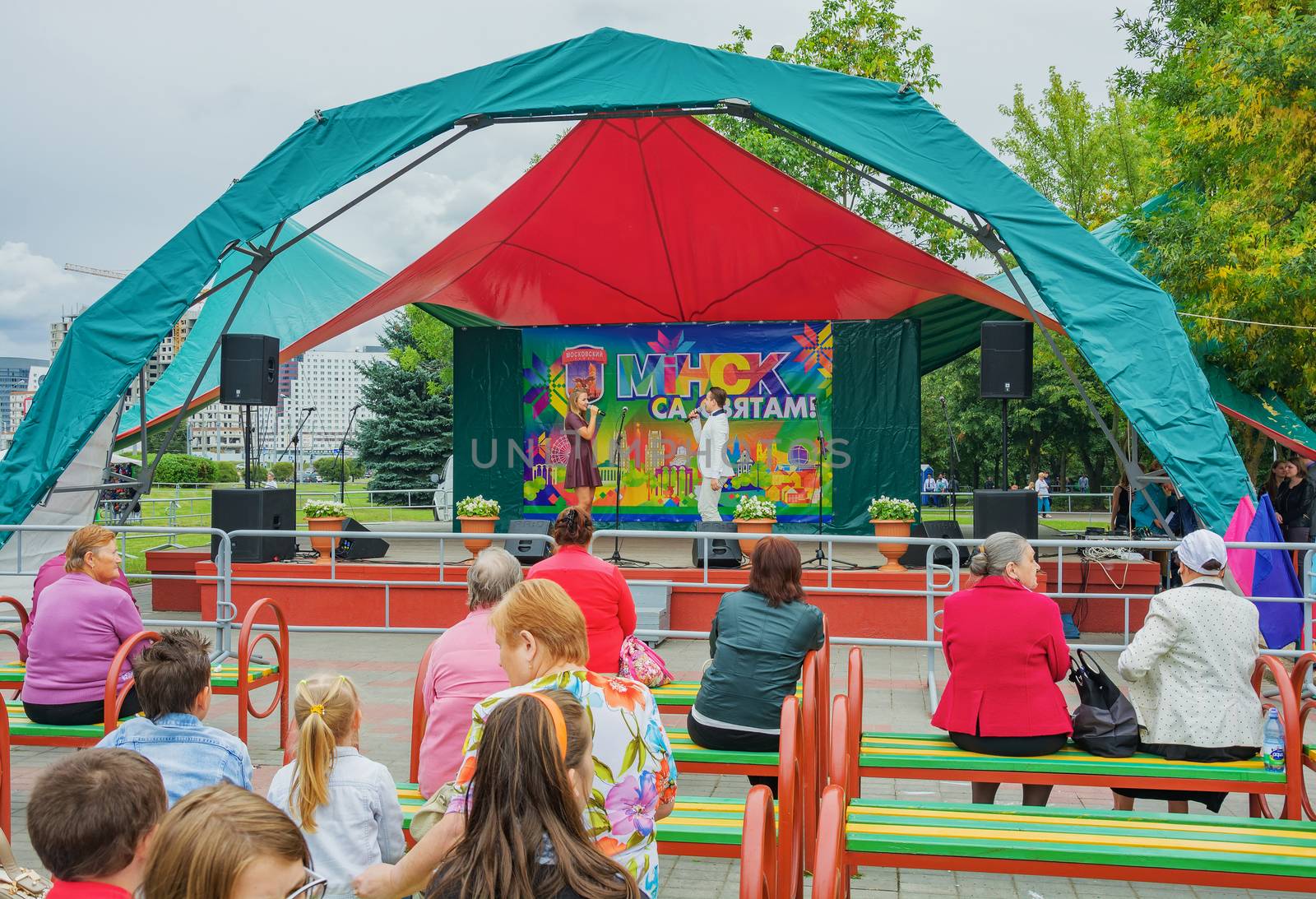 Young singer and singer sing a song on stage by Grommik