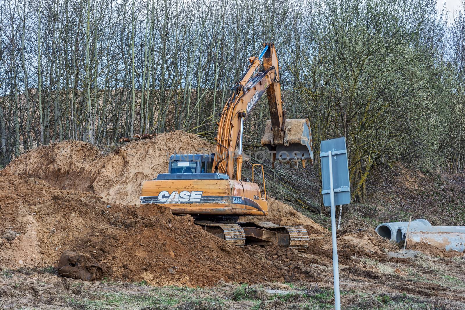 Excavator is digging a trench