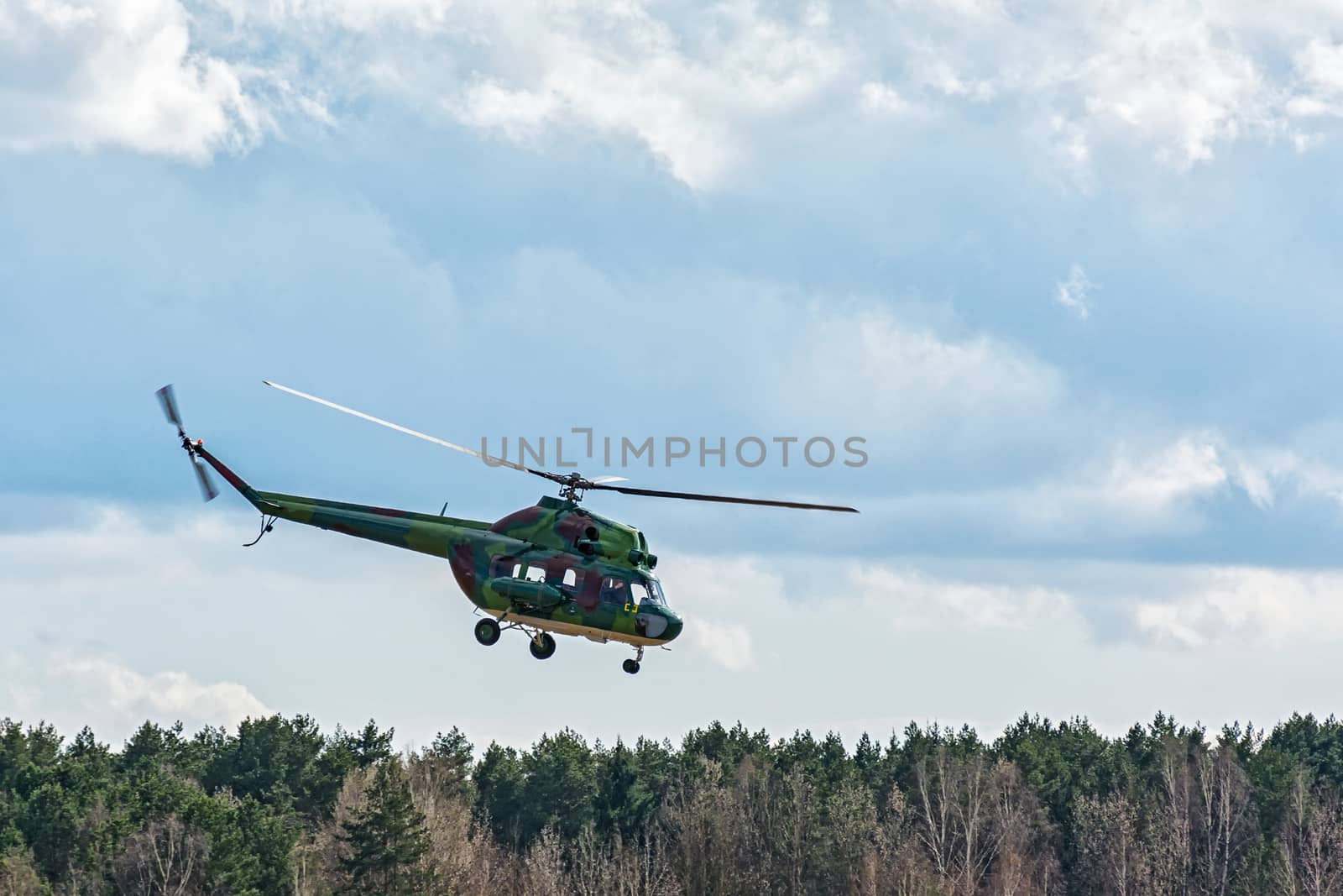 Belarus, Minsk - 15.04.2017: The helicopter MI-2 carries out a control flight around the forest belt