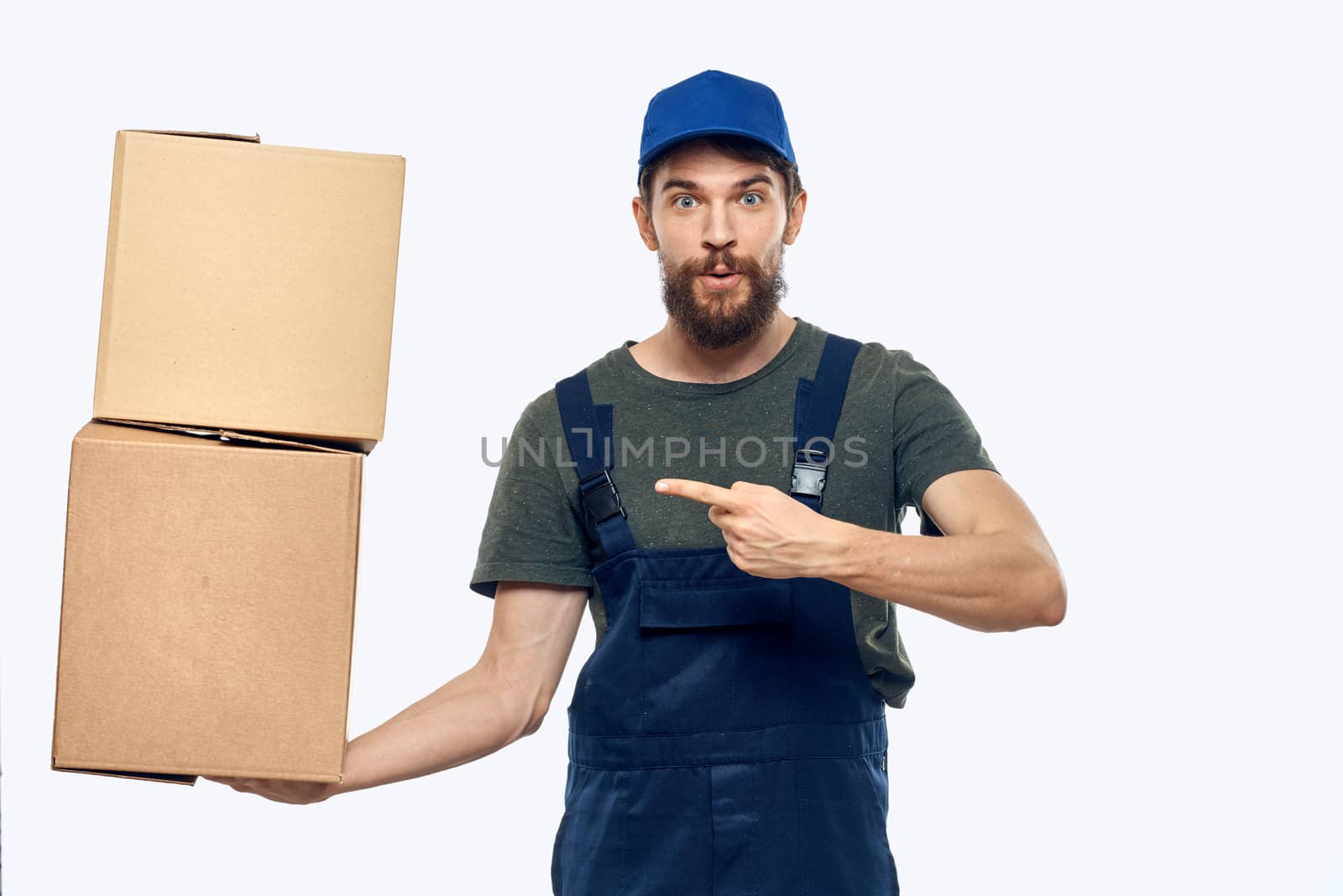 Working man with boxes in hands delivery service work lifestyle. High quality photo