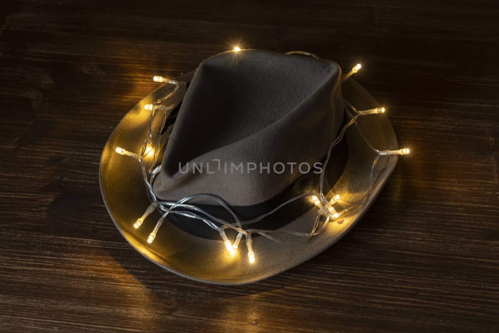 an old hat with a row of small lights wrapped by sergiodv