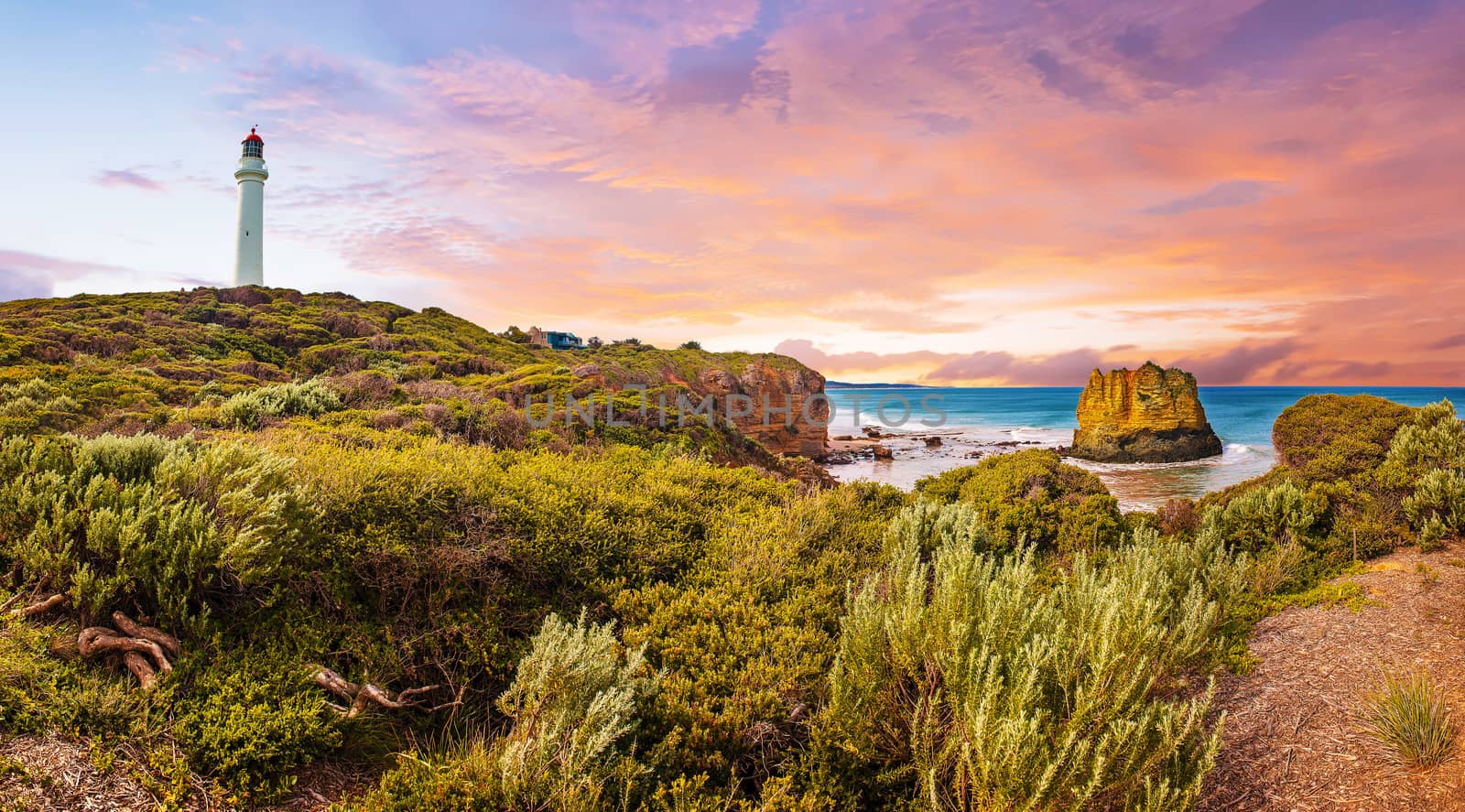 Sunset over Split Point Lighthouse and Eagle rock on Great Ocean by fyletto