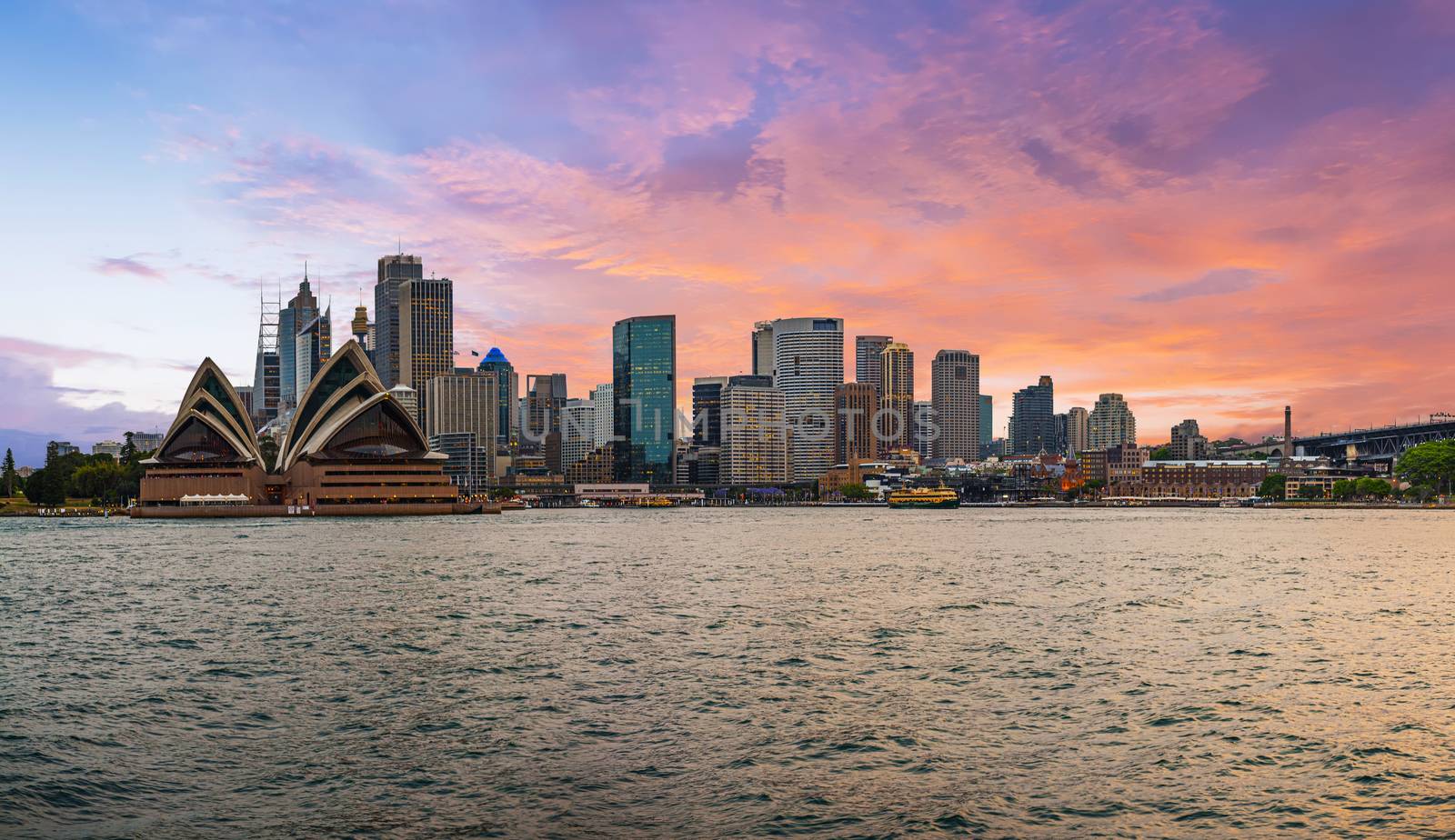 Beautiful vivid sunset over Sydney downtown skyline. New South Wales, Australia. Panoramic photo