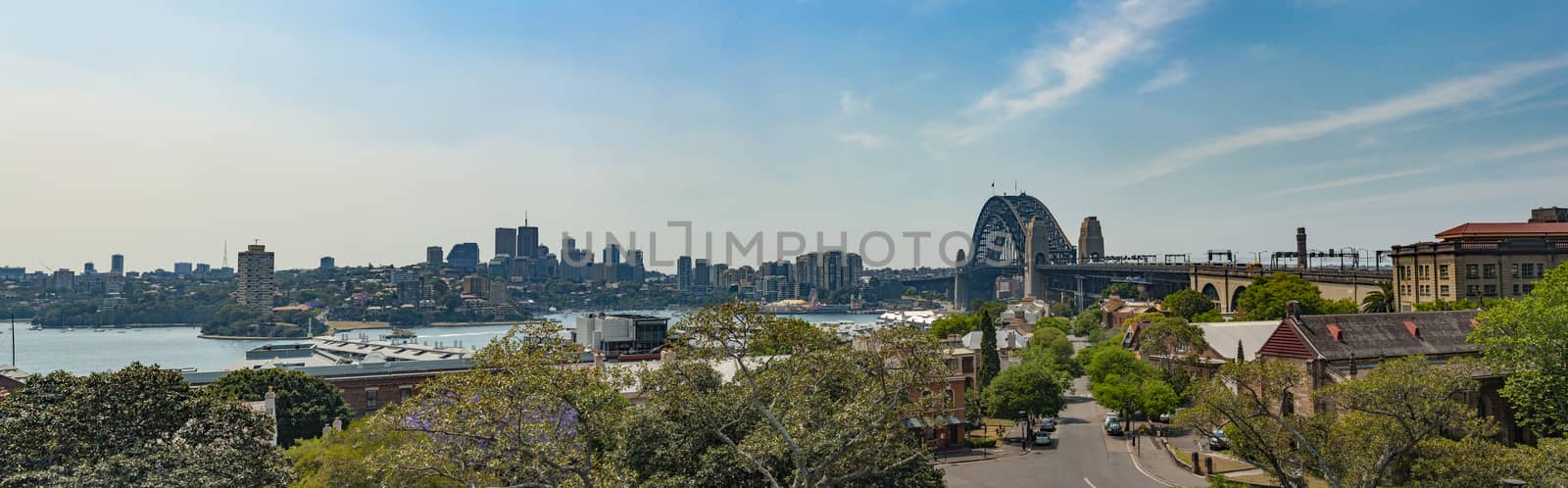 Panoramic photo of Sydney skyline with Harbour Bridge seen from Sydney Observatory area, Australia