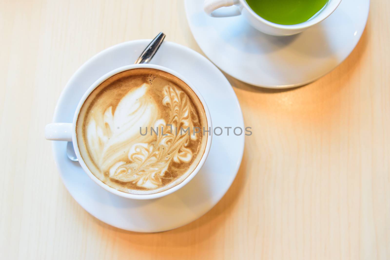hot coffee on table / hot cappuccino with nice pattern milk foam