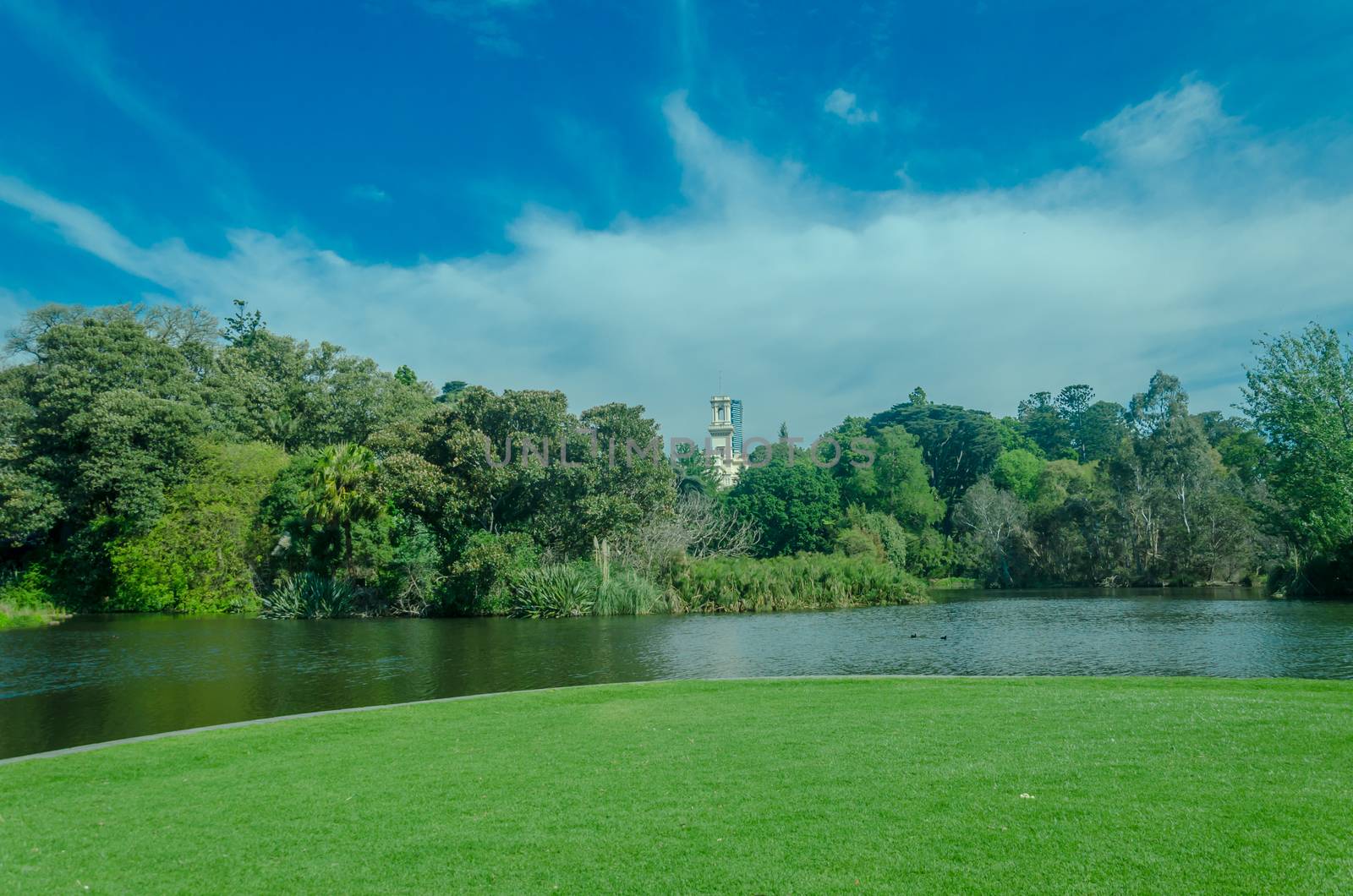 Lake and garden in front of house