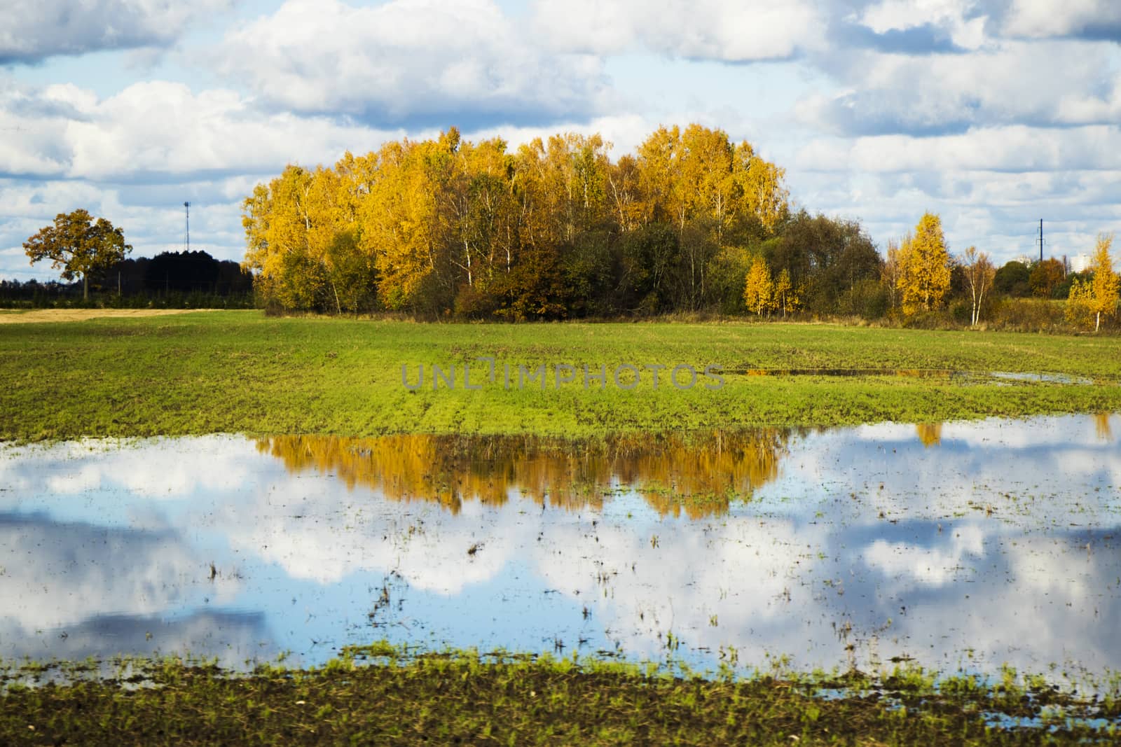 Landscape of the valley in Europe, Cloudy sky and autumn colors, trees and horizon.