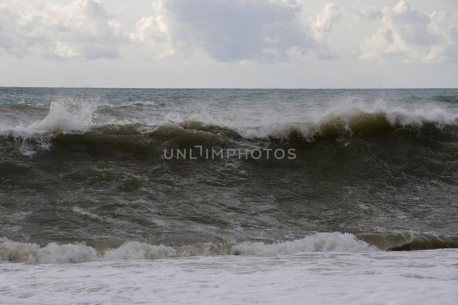 Stormy weather, waves and splashes in Batumi, Georgia. Stormy Black sea. by Taidundua