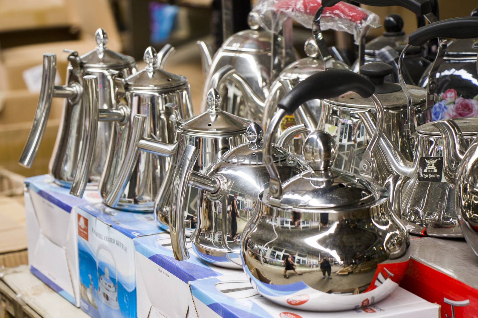 Teapot and kettle in the shop table, large group of kettles