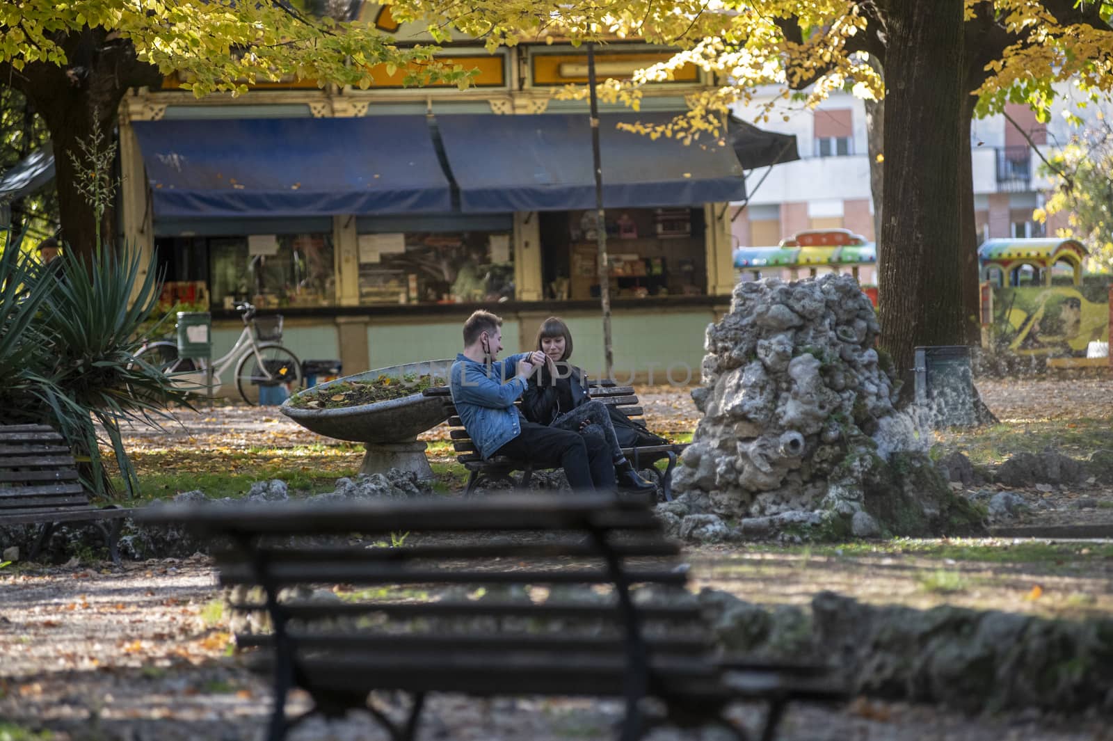 terni,italy october 21 2020:engaged couple sitting at the park