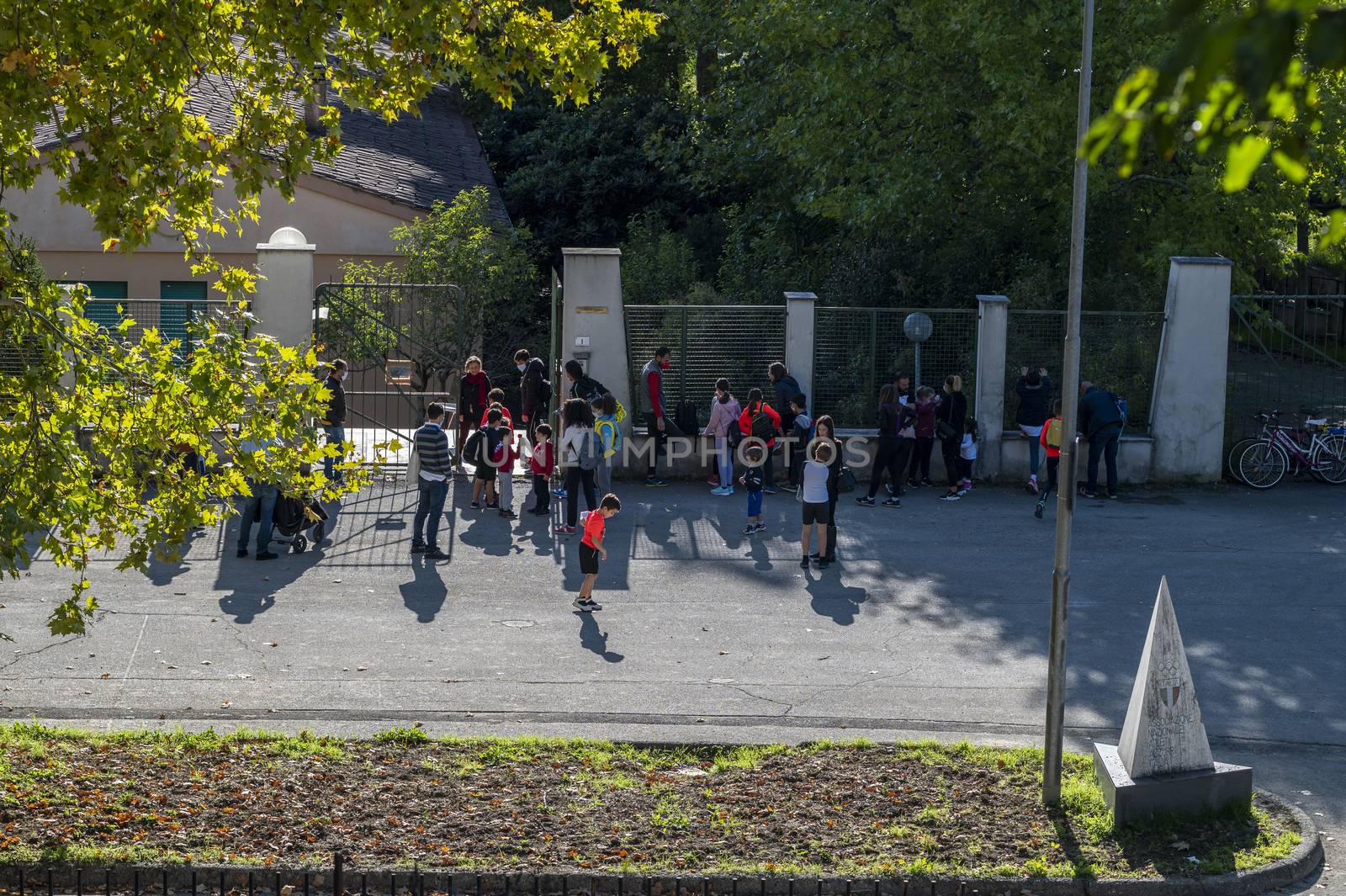 terni,italy october 21 2020:children with parents waiting to enter the school camp