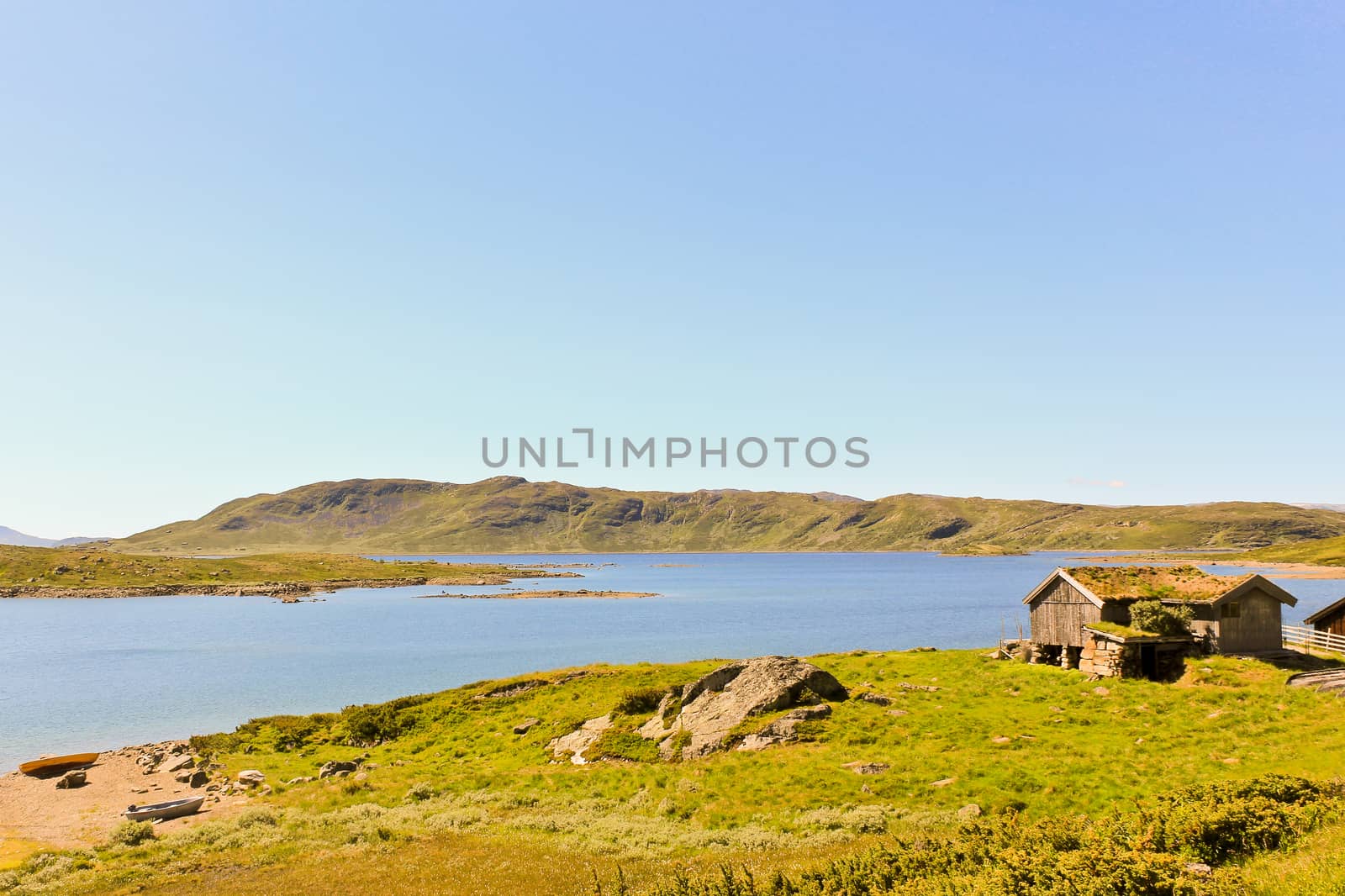 Vavatn lake and mountains in summertime in Hemsedal, Buskerud, Norway. by Arkadij