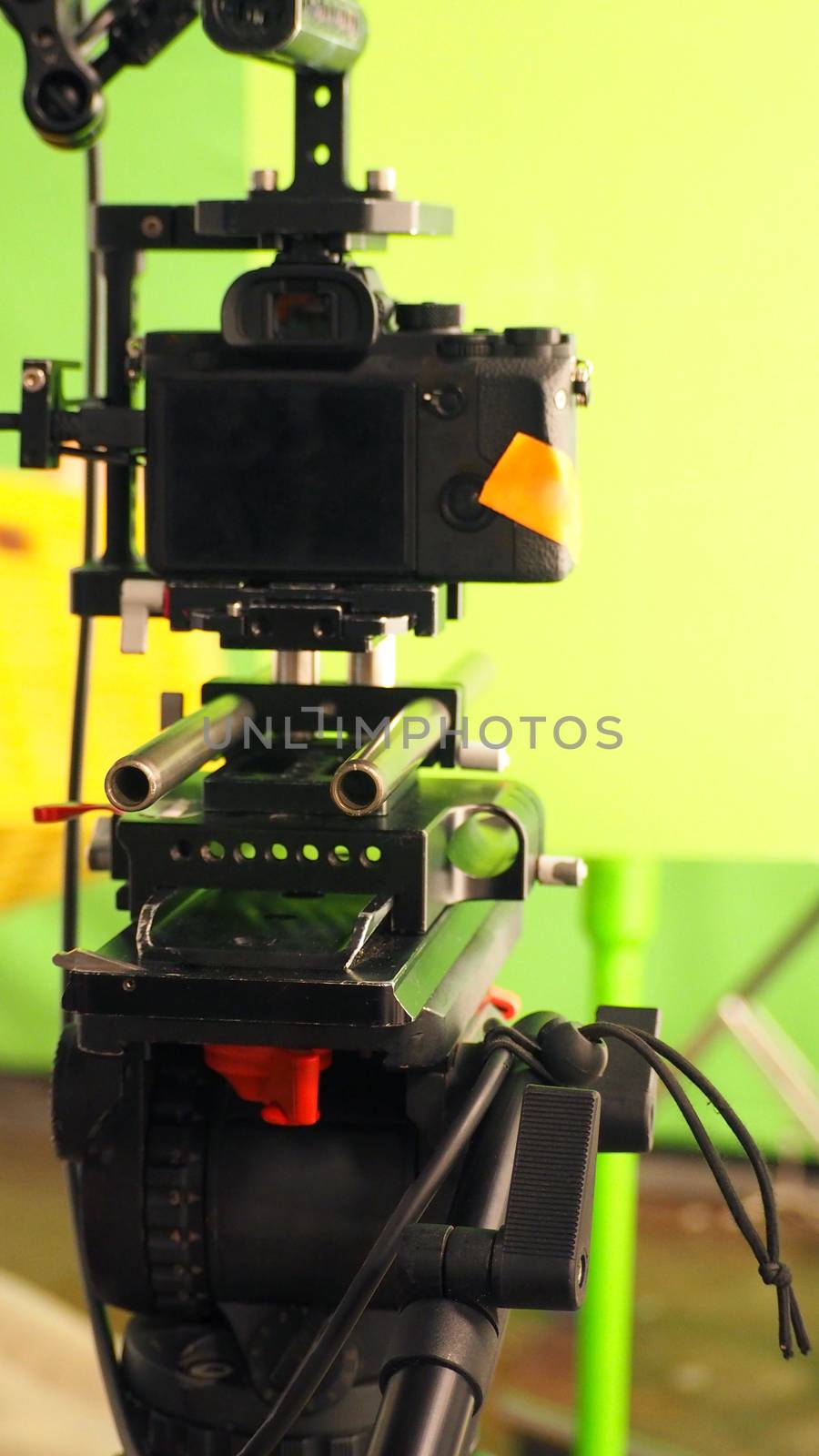 Behind video camera and green screen by gnepphoto