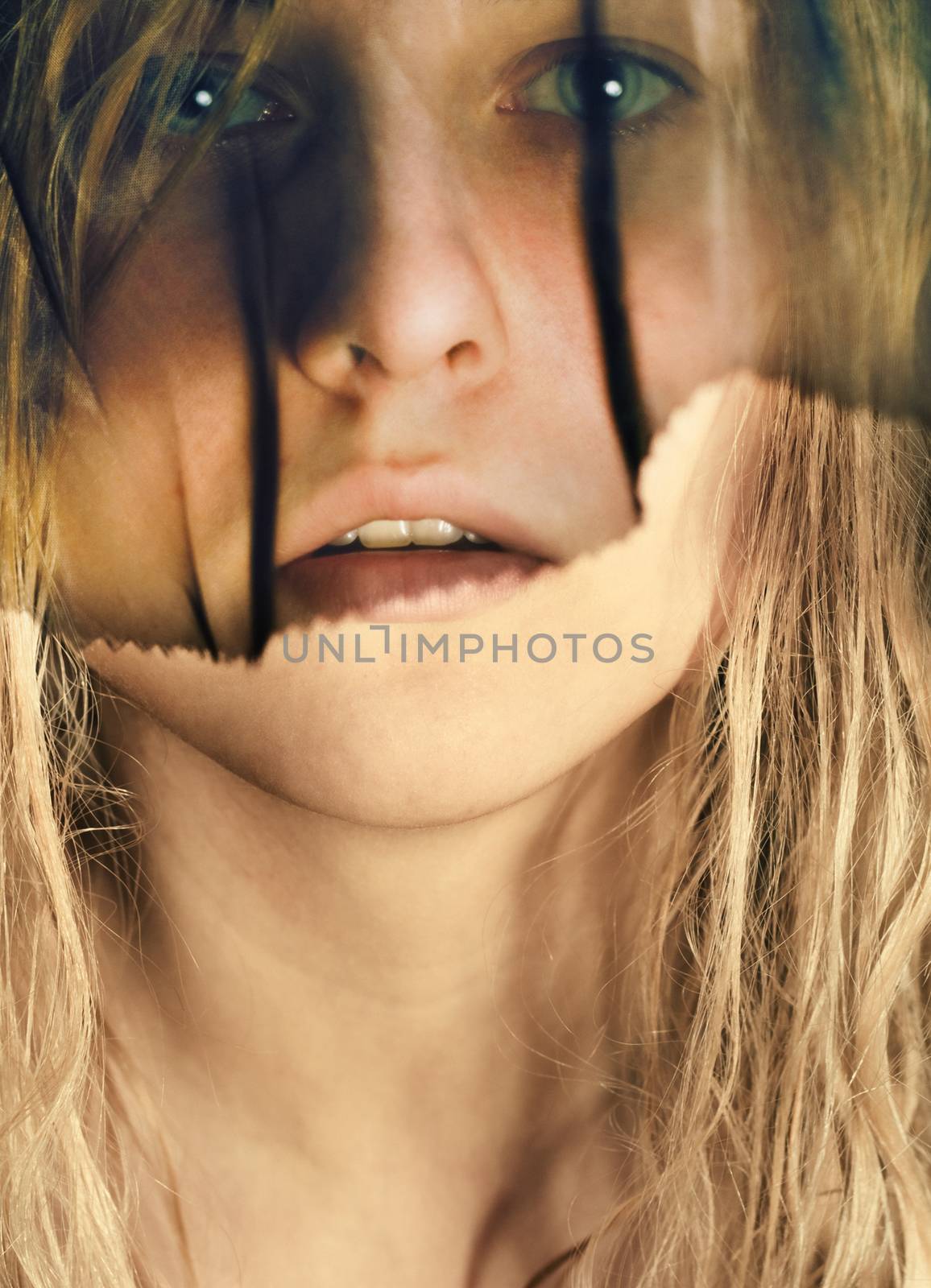 Emotional portrait of young blonde woman wearing black veil, emotion and feelings