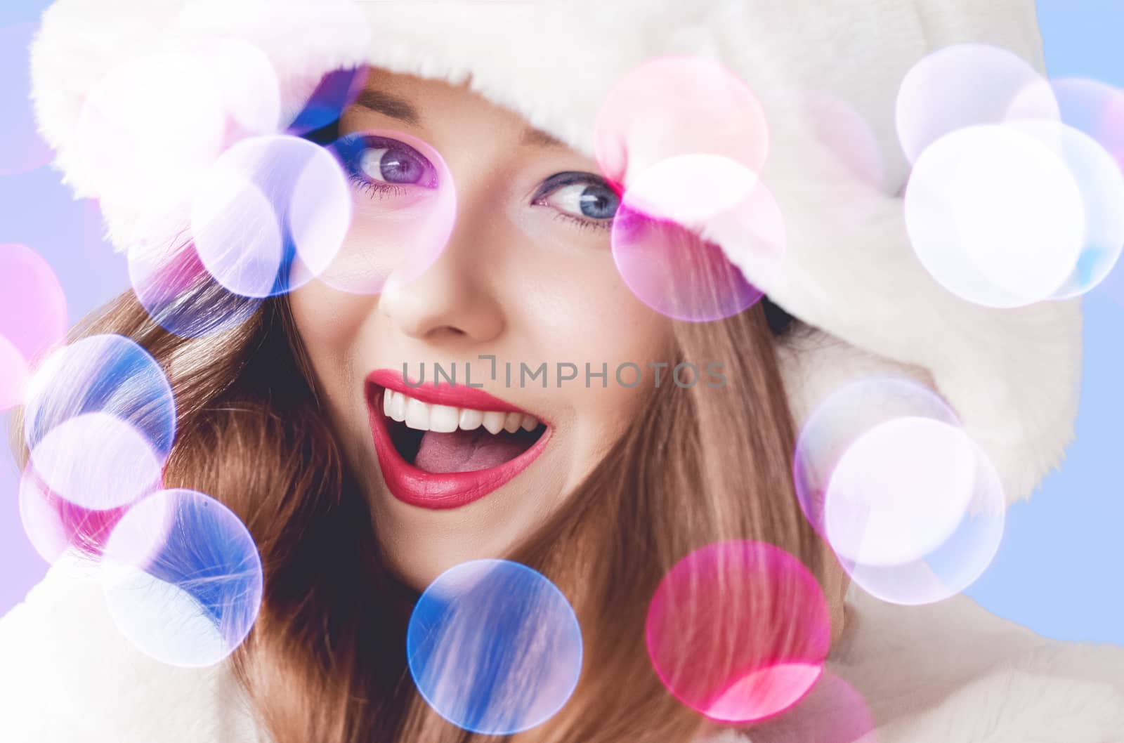 Merry Christmas portrait of smiling young woman wearing fluffy white fur coat, luxury beauty and happy holidays