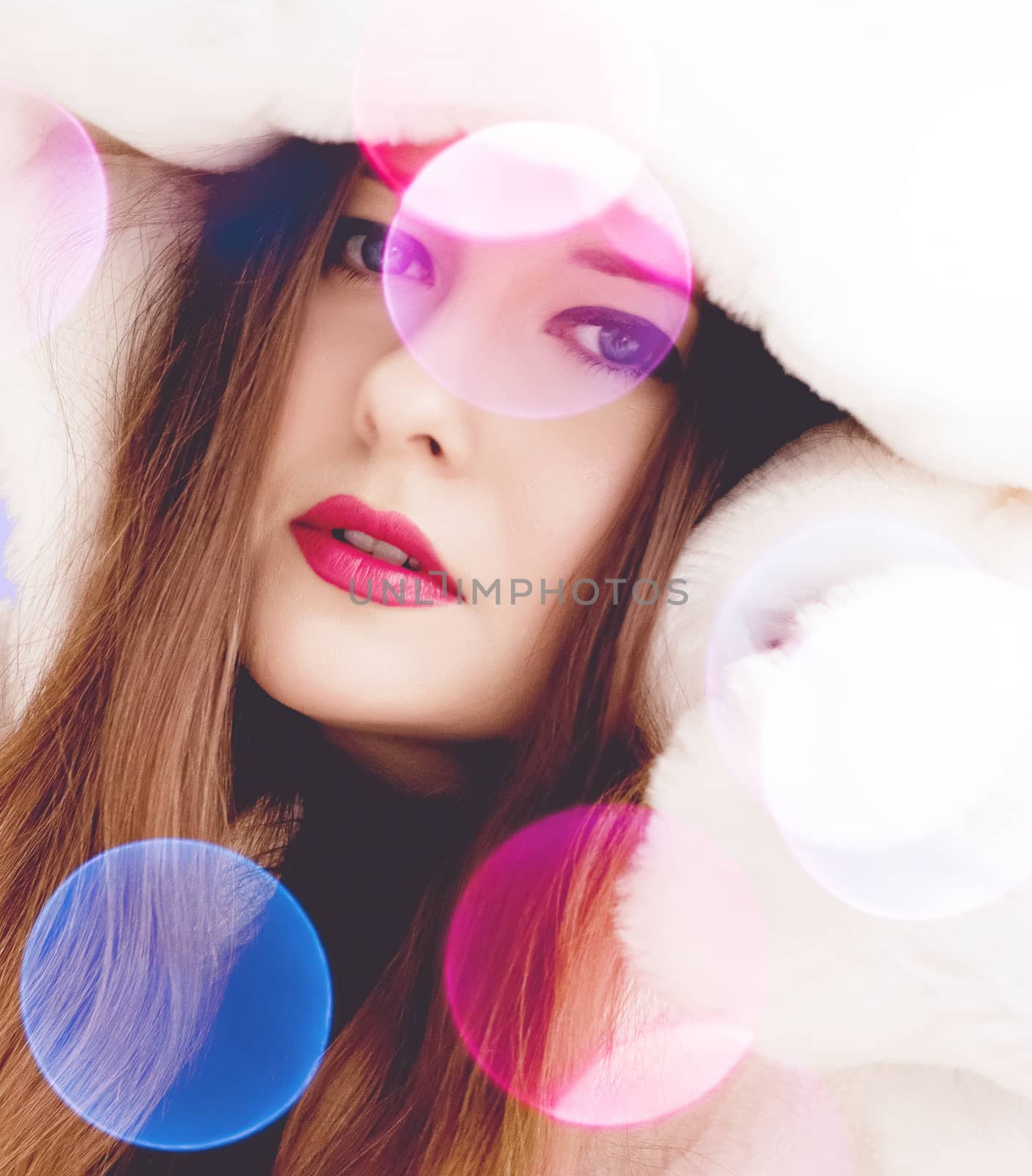 Merry Christmas portrait of smiling young woman wearing fluffy white fur coat, luxury beauty and happy holidays